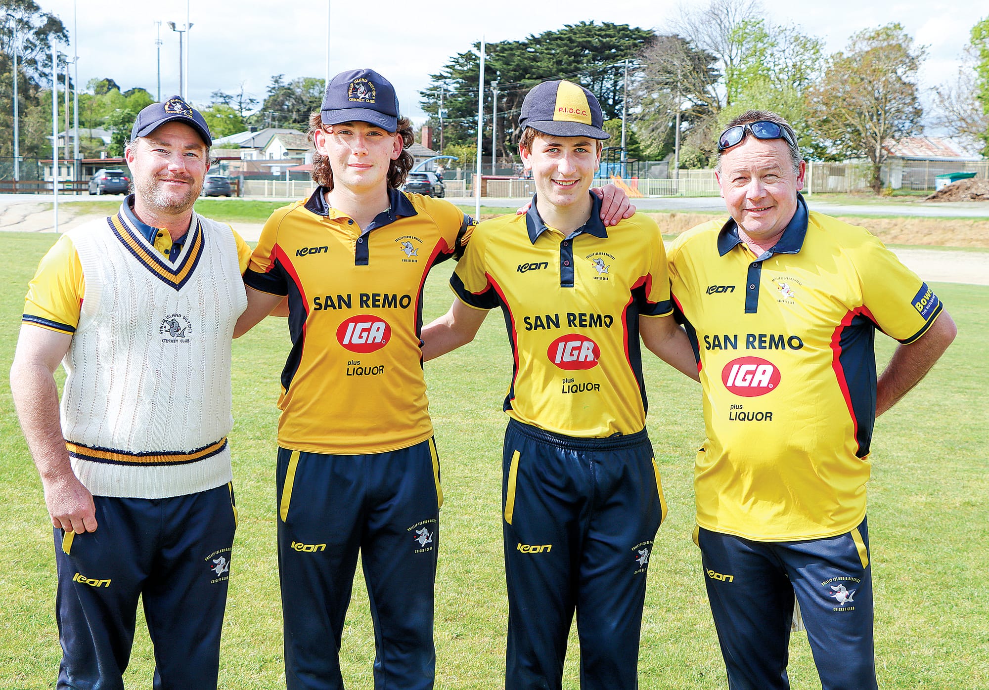 Phillip Island father-son combinations David and Heath Womersley and Daniel and George McCausland get ready for Korumburra’s innings.