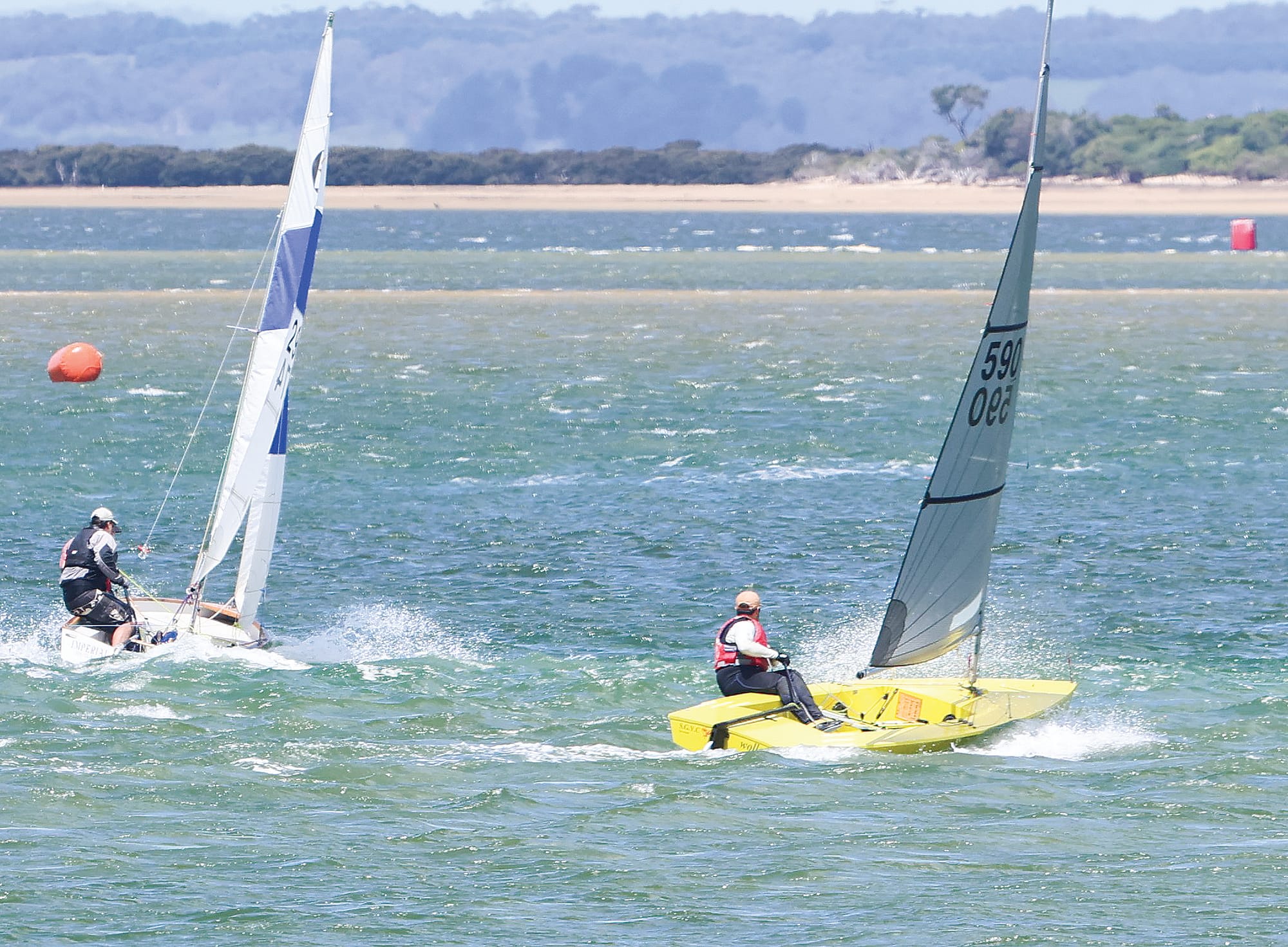 State Impulse Champion Matt Keily (yellow boat) in action in Anderson Inlet on a delightfully windy day last Sunday.