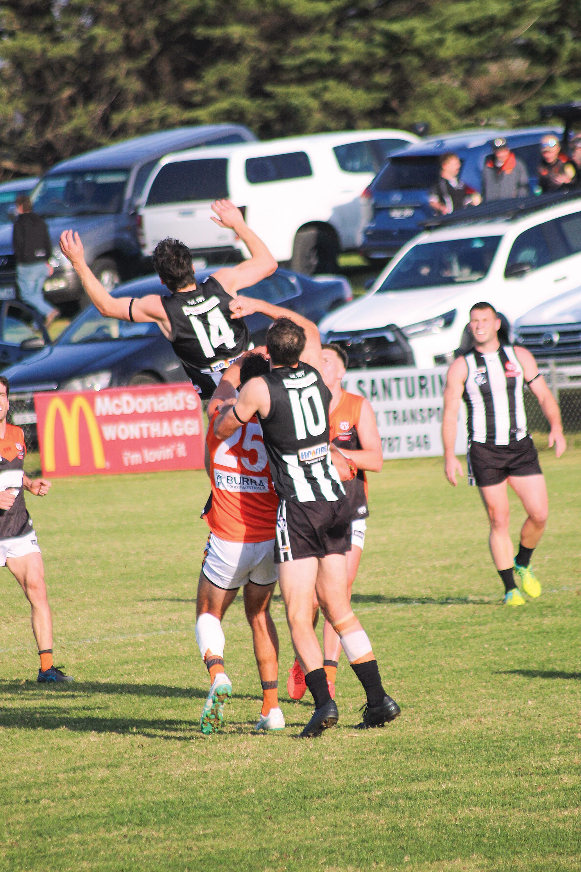 Dalyston’s Michael Marotta aims for a high mark against Korumburra-Bena with Evan Allaway on his back. Photo: Michelle Chisholm.