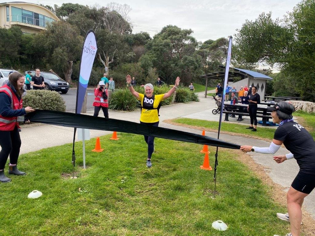 Anne McDonald of Inverloch crosses the line in her 100th parkrun last Saturday.
