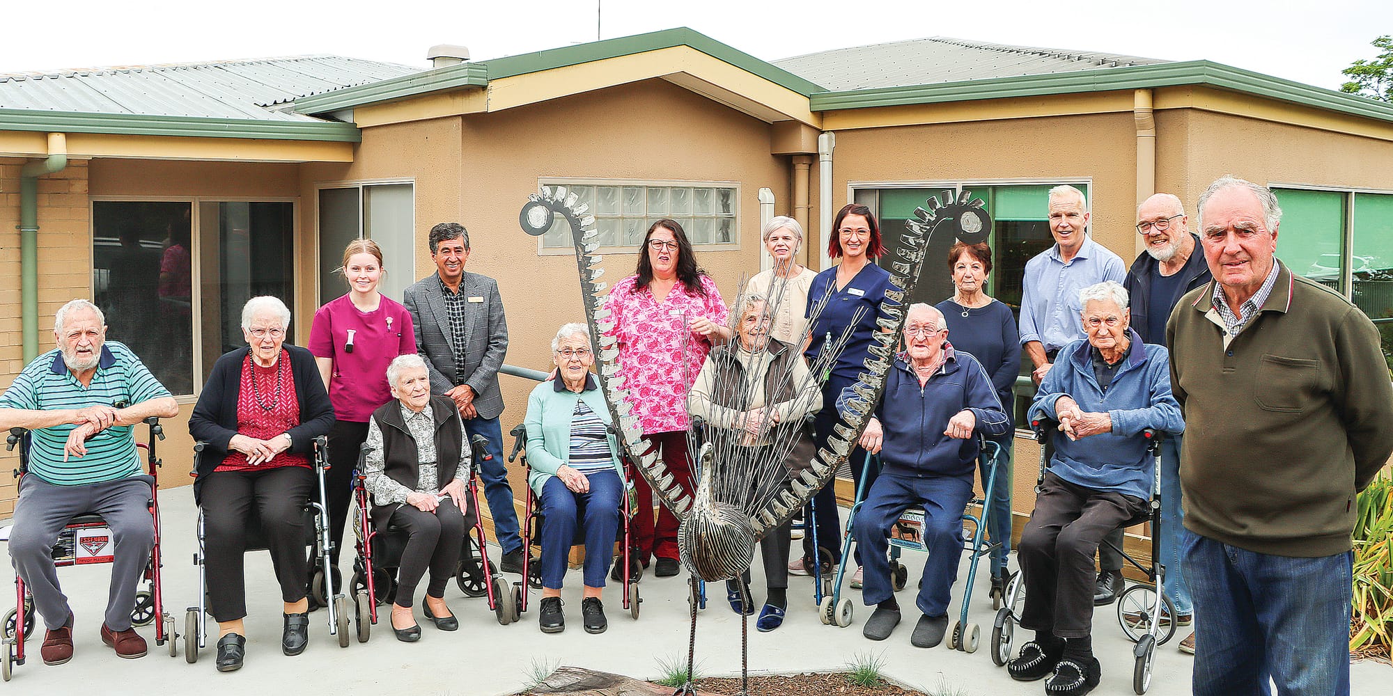 Woorayl Lodge staff, residents, board members and Rotary representatives couldn’t be happier with their new lyrebird sculpture which was expertly crafted by John Vuilerman (right).