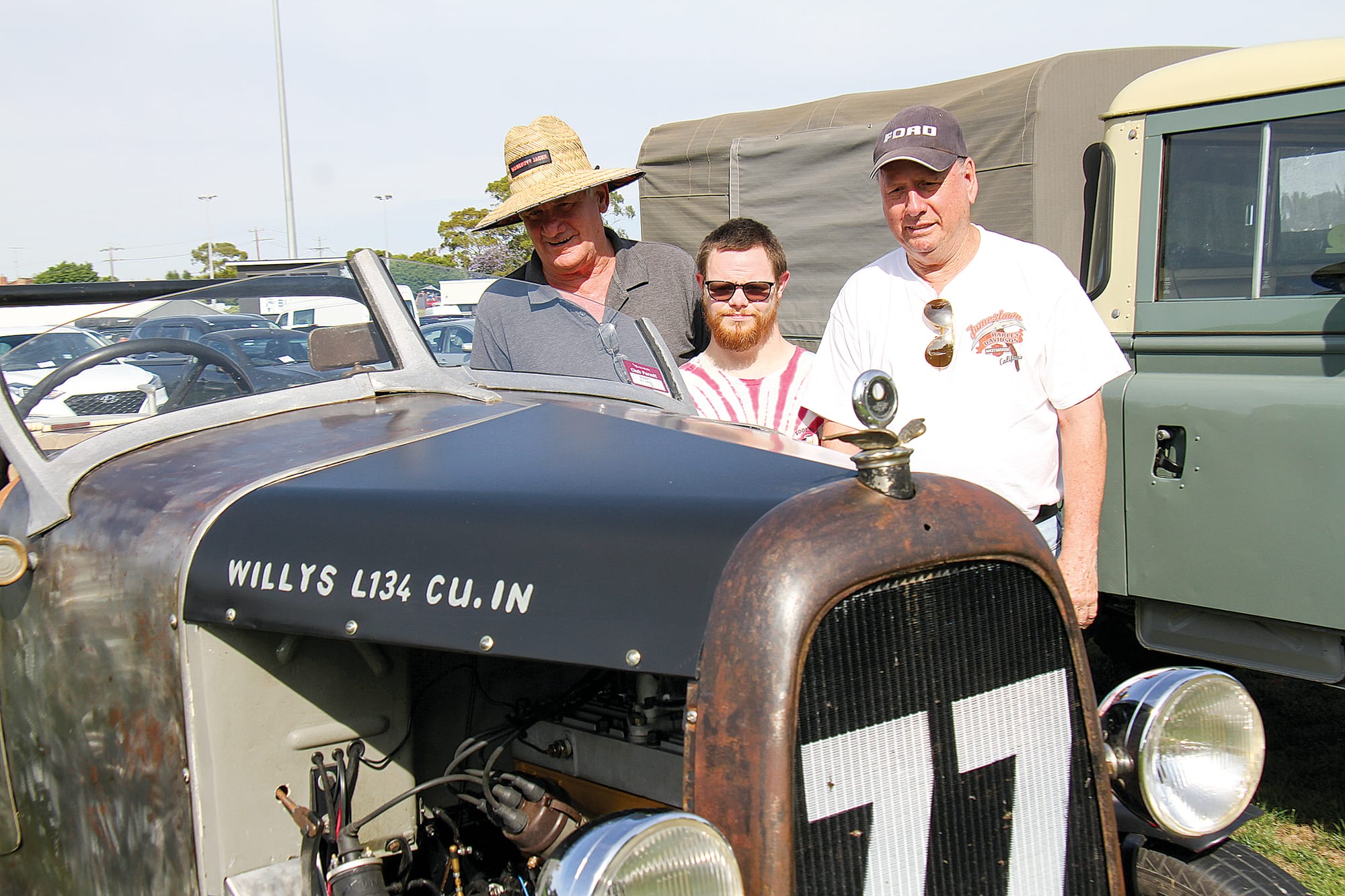 Terry and Matthew Cameron with Terry Dowsett admiring a WW2 Willys L134. B147_0225