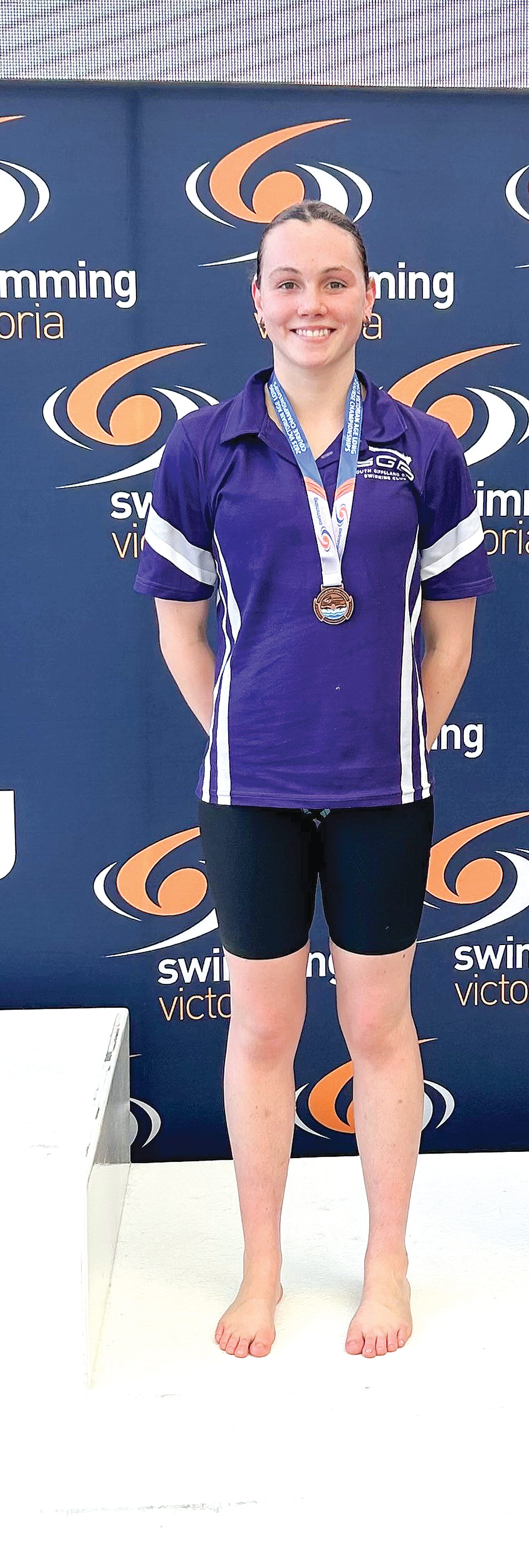 Miah celebrates her bronze medal.