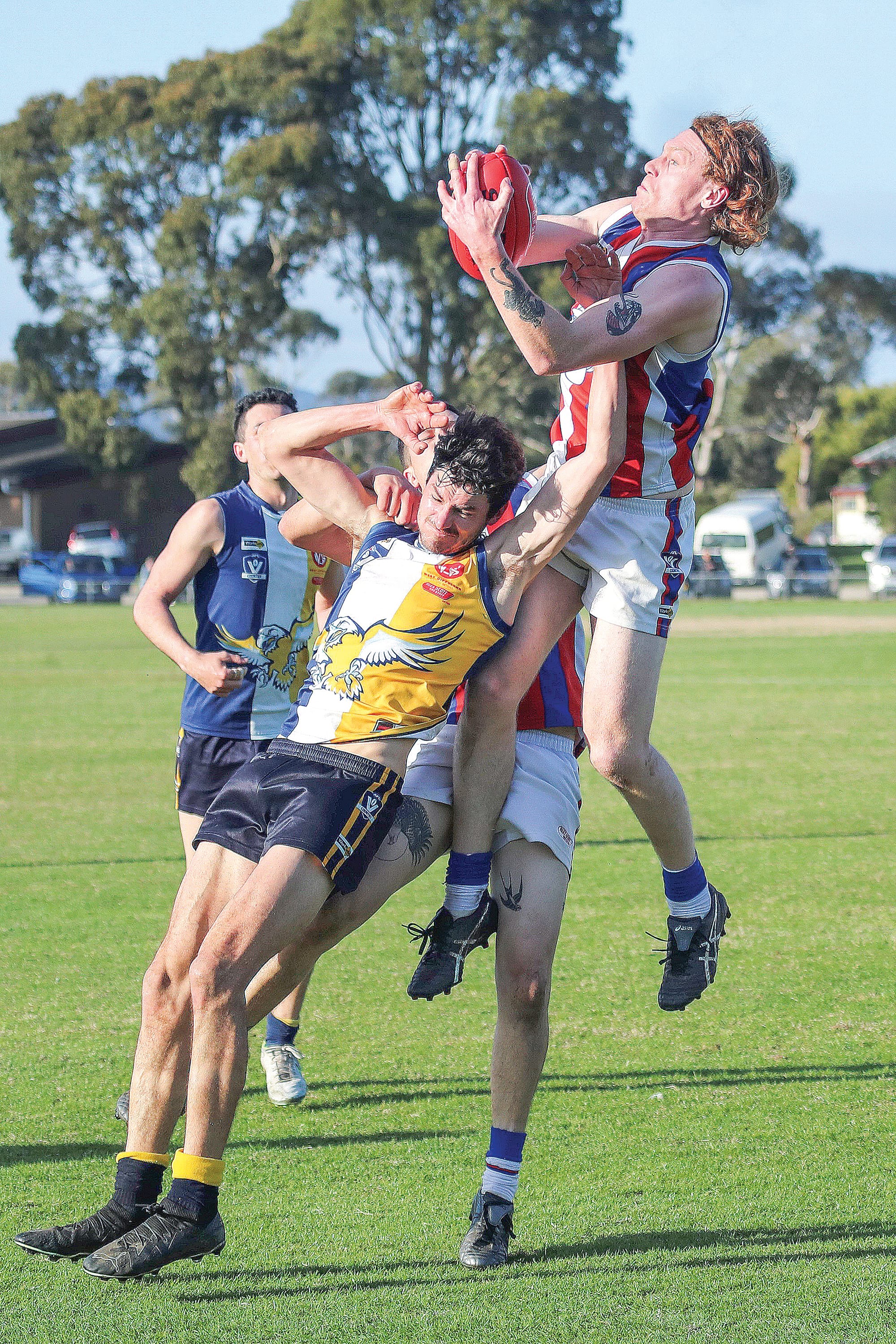 Tarquin McMillan marks for Phillip Island during its narrow senior loss to Inverloch Kongwak. Photo: Carol Radcliff