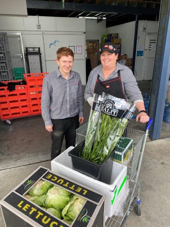 Luke Kelly and Tracey de Merlo of Tarwin Lower IGA make sure their customers are well supplied with food and produce... even fresh flowers.