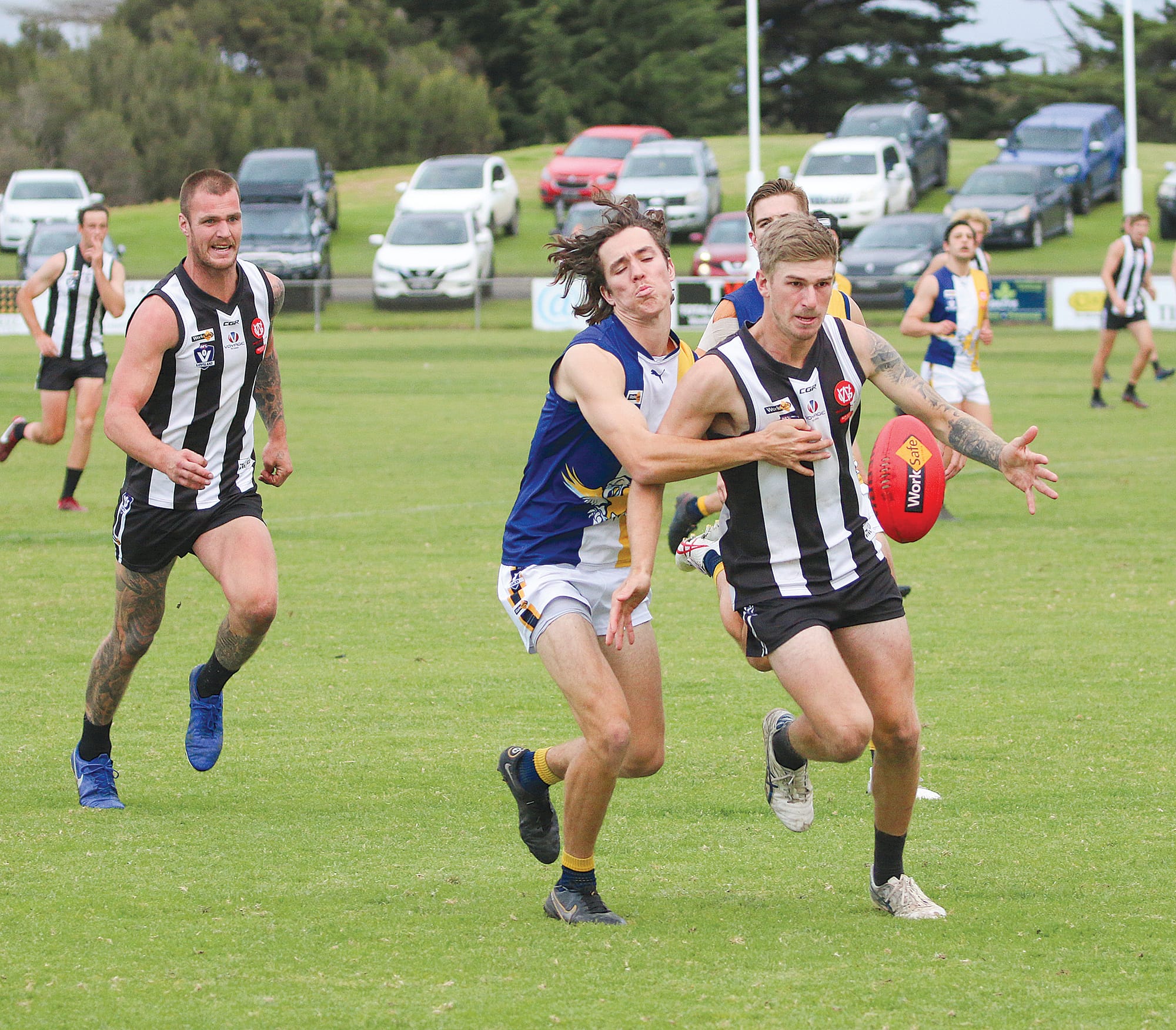 Mason Storr leads his Inverloch opponent after the loose ball. ob27_2123w