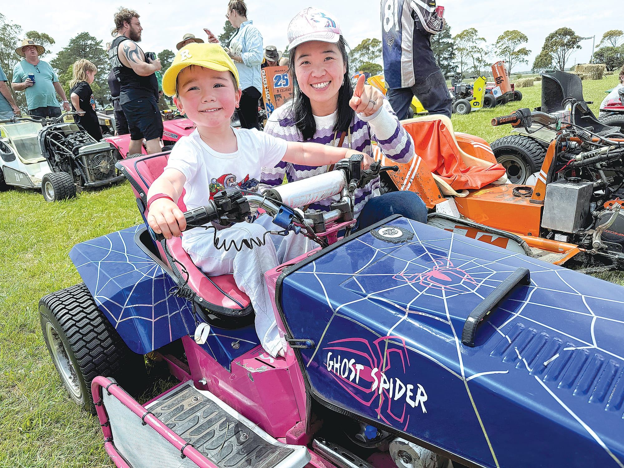 Estella Tang of Leongatha with Keanu Atkins giving one of the racing lawnmowers a try at the Welshpool Recreation Reserve on Saturday.
