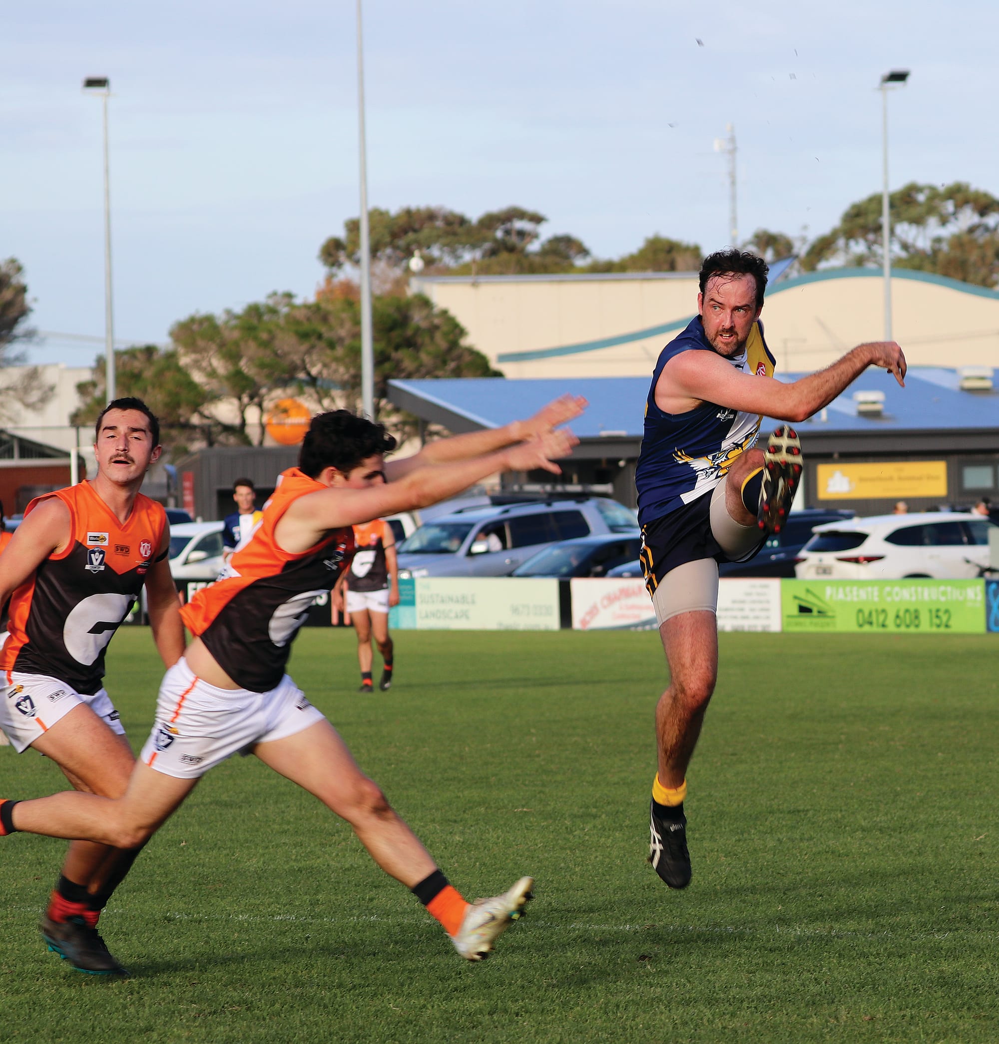 Clinton McCaughan keeps the ball in Inverloch’s forward 50 and takes a shot at goal. Z38_2223