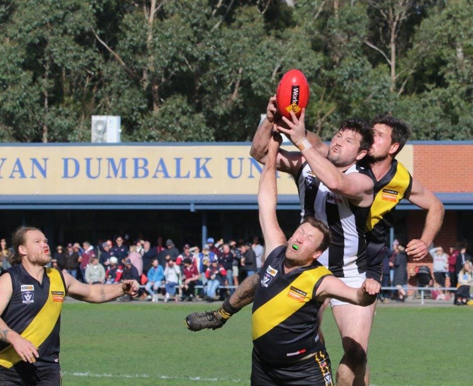 Yinnar’s Stuart Patten rises above the pack to attempt the mark halfway through the second quarter in a thrilling, low-scoring win over Foster at Meeniyan on Saturday.