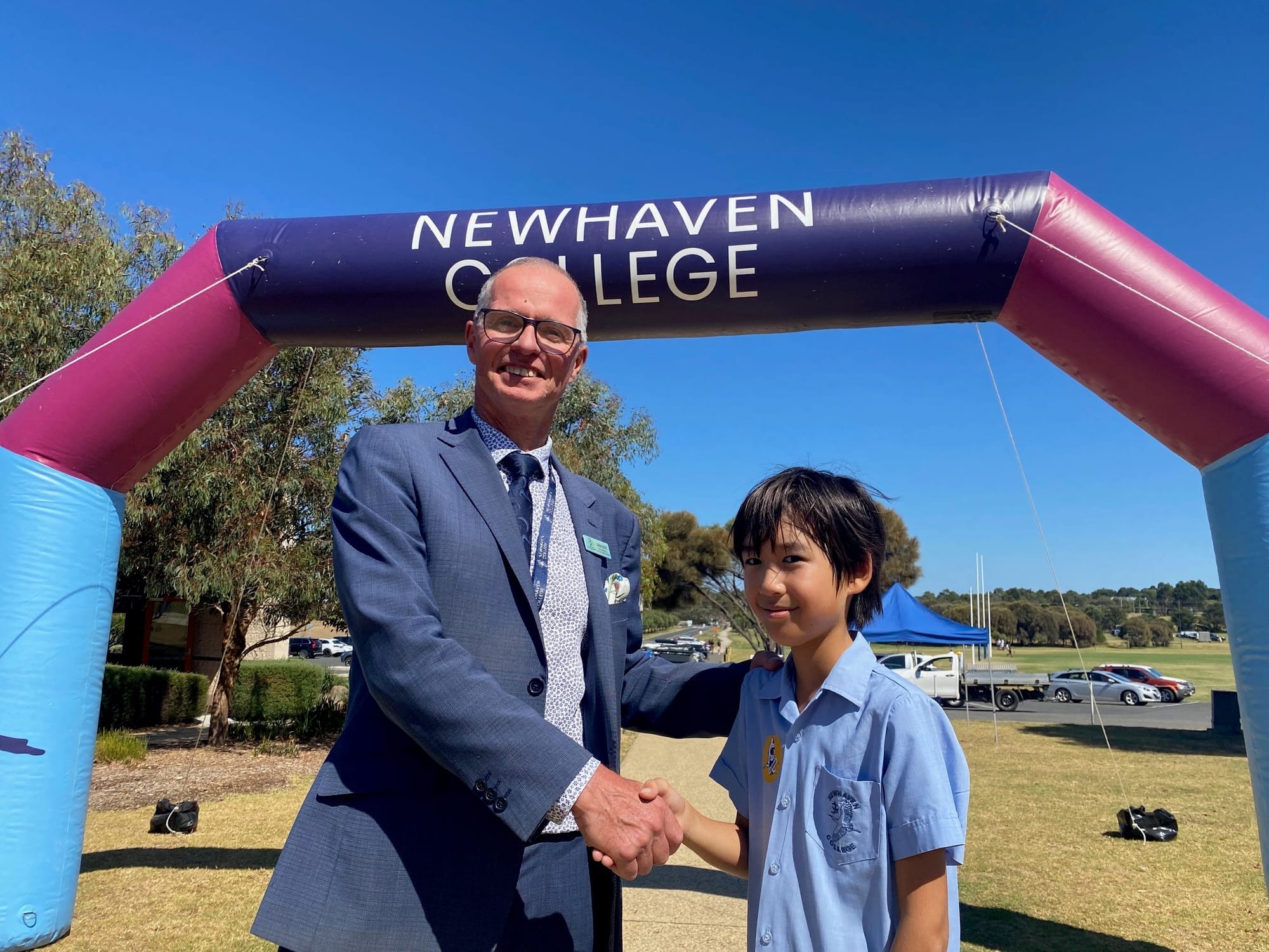 Jason Scott, Head of Senior School at Newhaven College, welcomes William Lee to the college’s open day, which was Jason’s last after plans to move on to other goals in June including the 50th anniversary Berlin Marathon.
