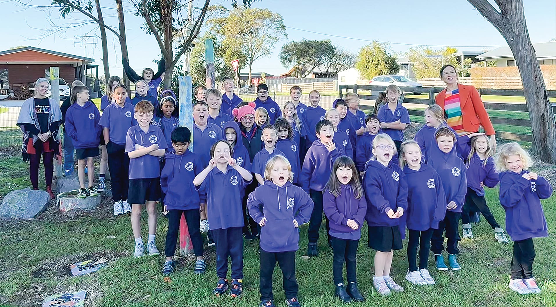Jordan Crugnale MP with the whole school in the landscape project area.