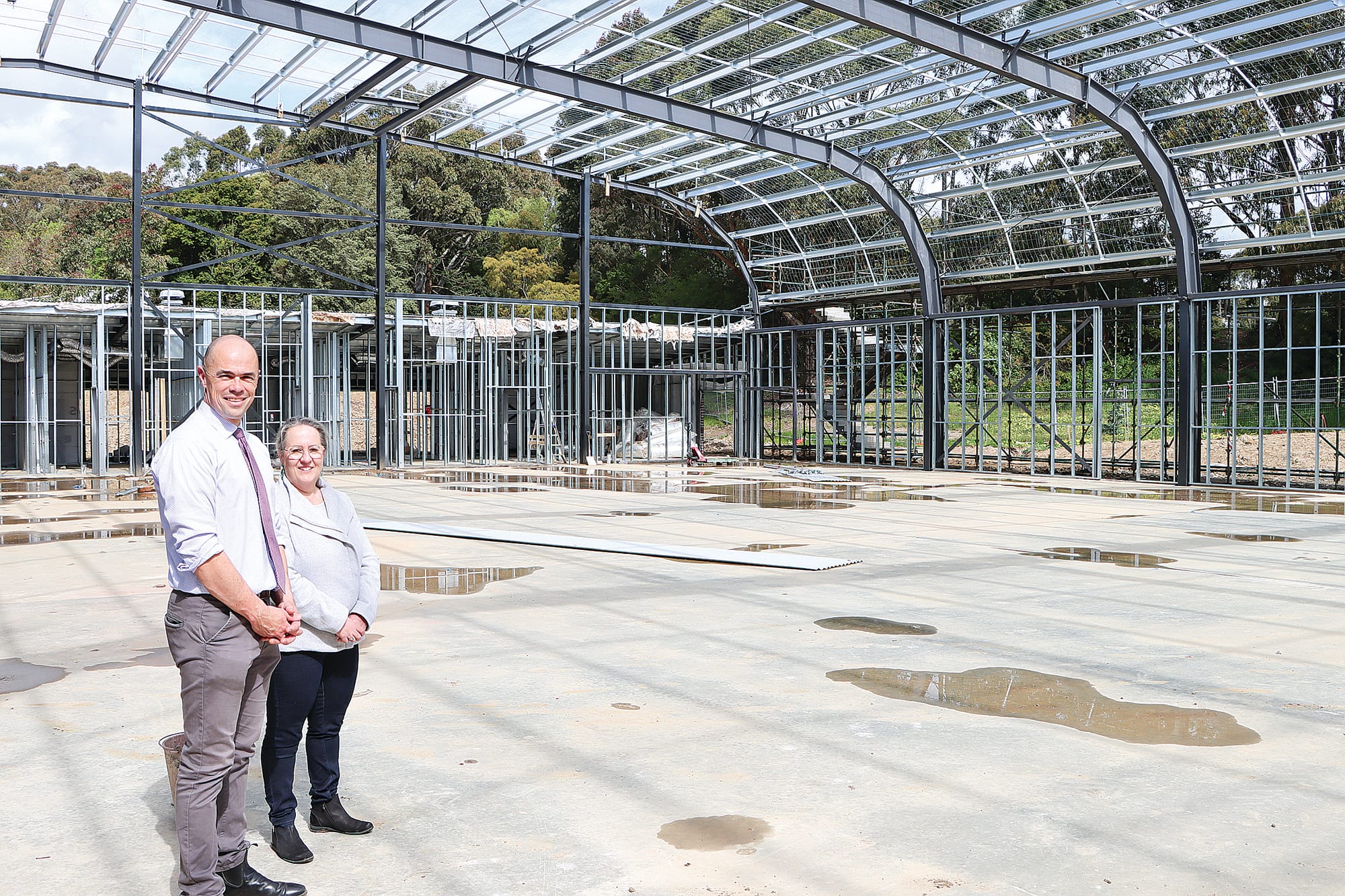 Assistant principal John Wilson and principal Vaya Dauphin are enjoying seeing the progress of the new gymnasium, basketball, netball and performing arts building.
