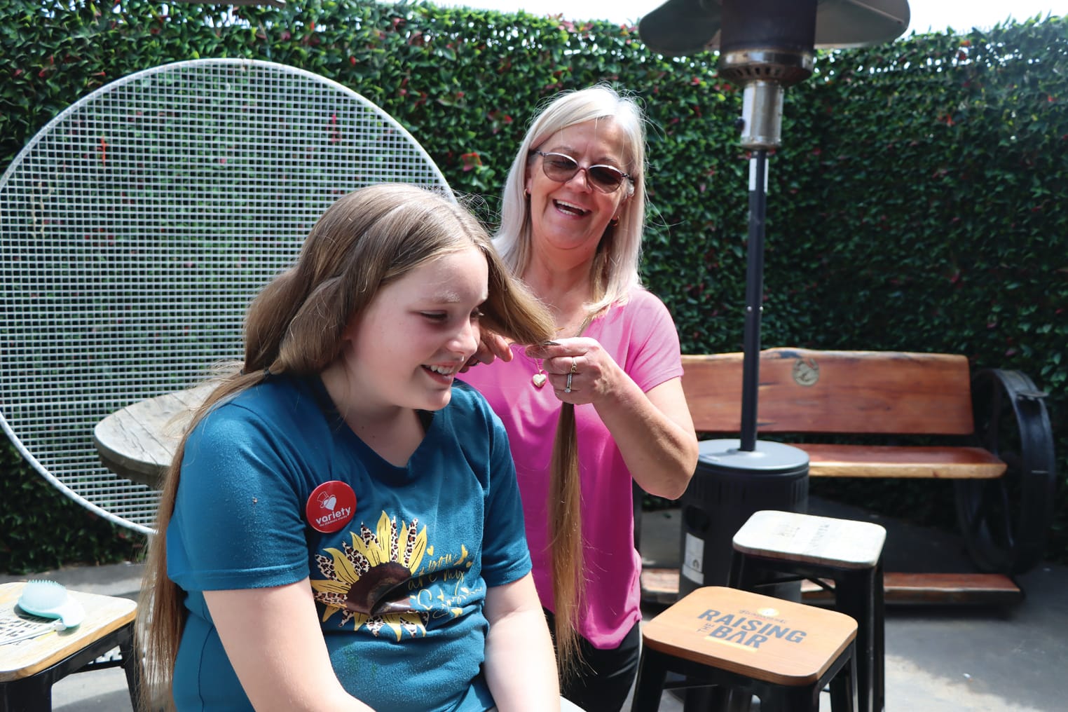 It’s all smiles as Kim Rose prepares to cut one of Tayla’s locks. A40_4523