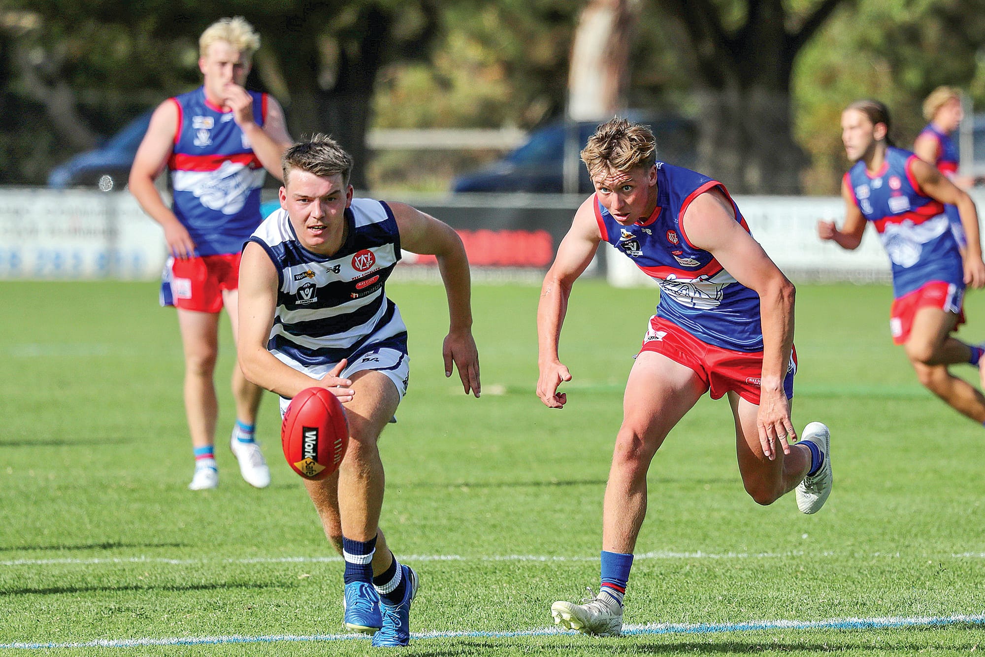 Max Walton eyes off the Sherrin as he races against his Nar Nar Goon opponent.