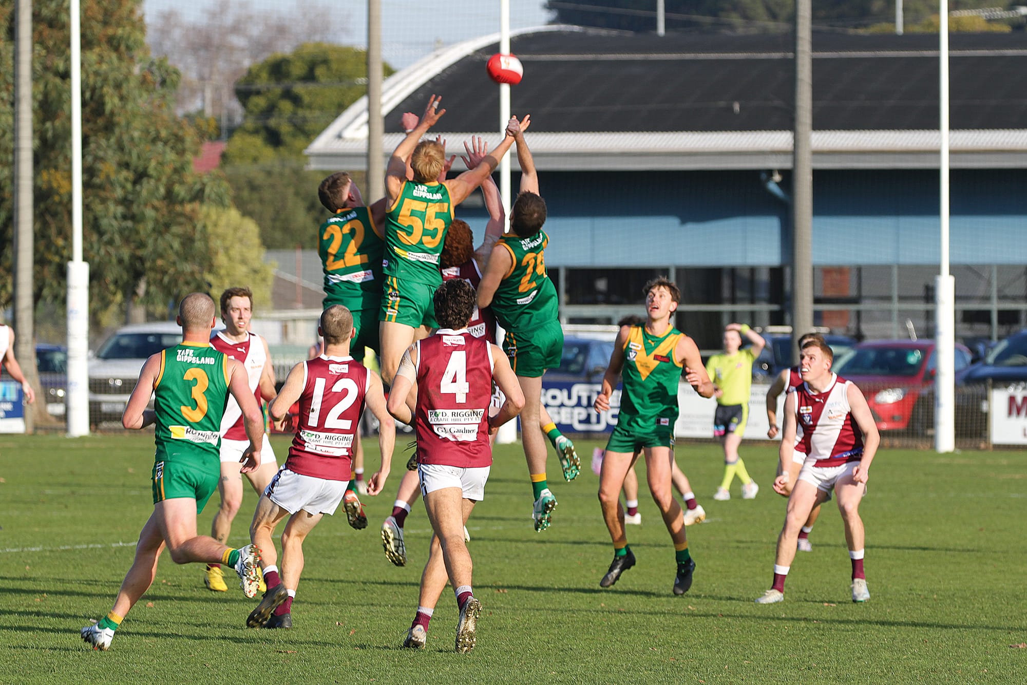 Parrot’s Patrick Ireland, Luke Bowman and Beau Grabham Andrews contest a high mark over the Maroons. B65_2525