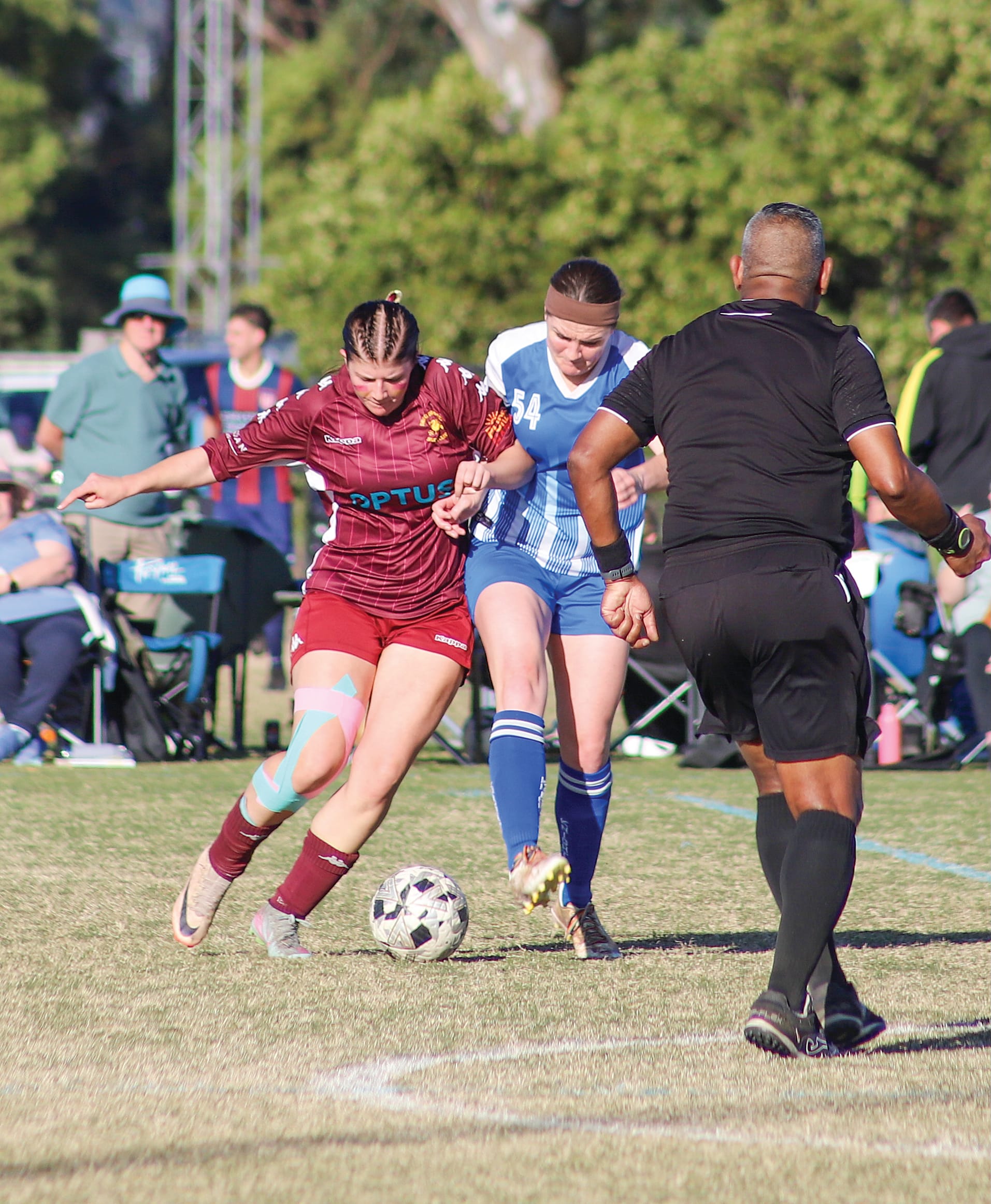 Leongatha Senior Women’s captain Bernie Fitzgerald battles for possession against Drouin midfielder Savannah. 
