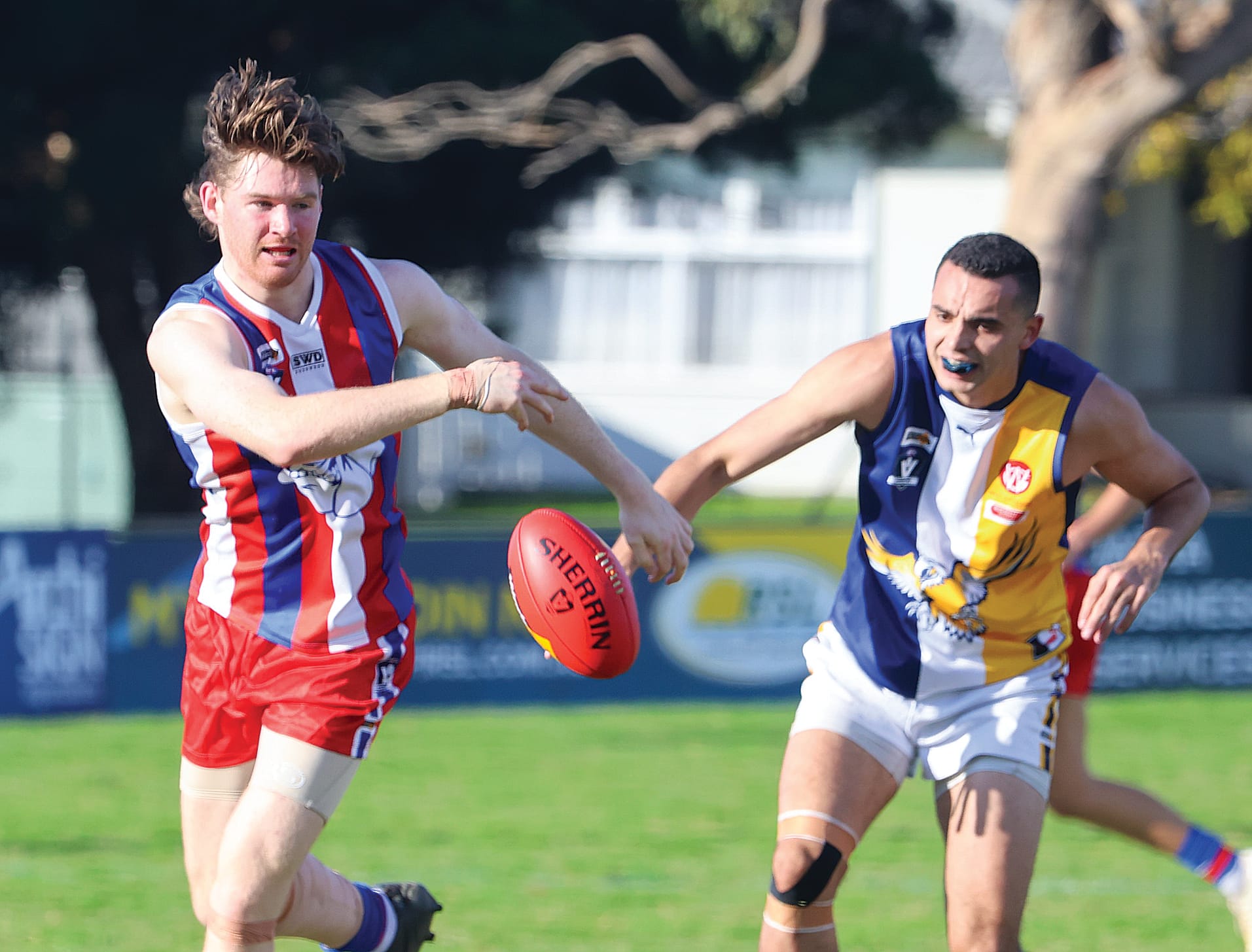 Phillip Island’s Daniel Bourke had a ding-dong battle in the ruck against Marcus Toussaint getting the better of the IK big man in this follow up after a throw-in.