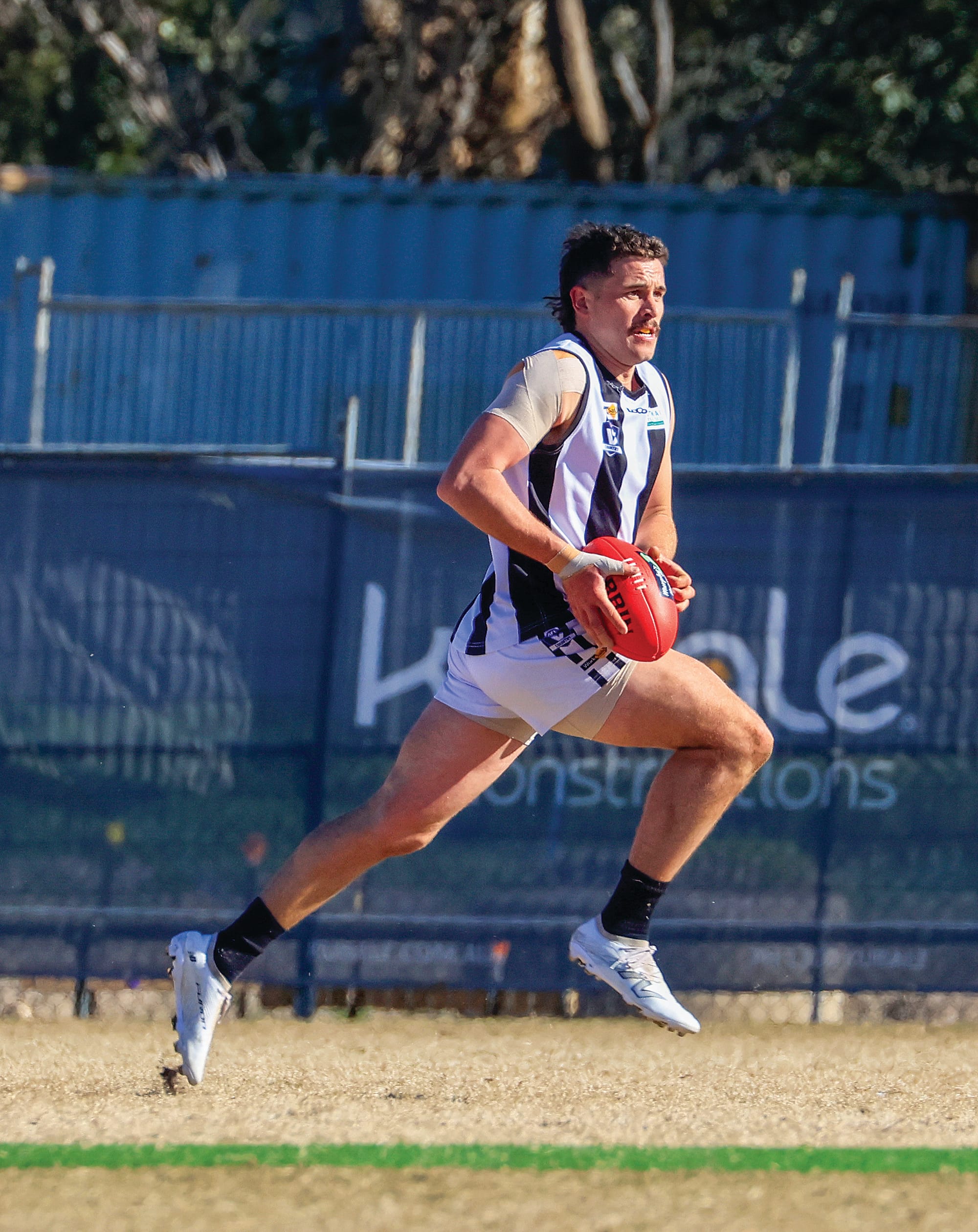Joel Norton takes control of play for Poowong. 
