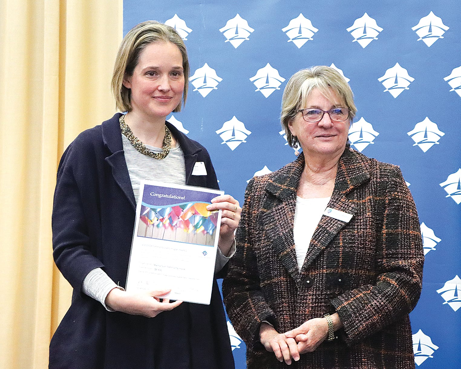 Beth Arnold of Manna Gum Community House welcomes an $8800 contribution towards a (Foster community hygiene station feasibility study), with Cr Jenni Keerie. A06_3124