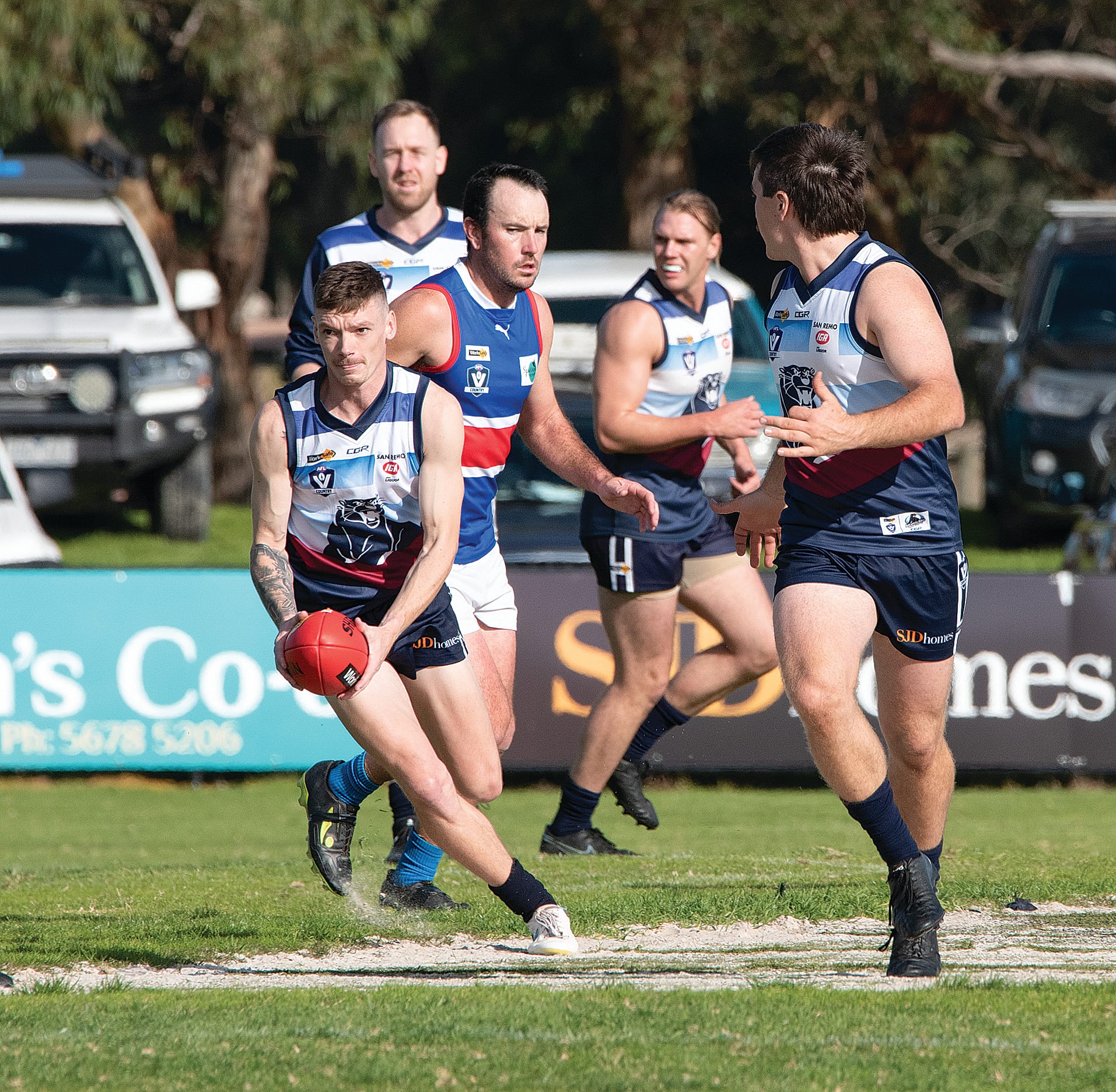 Kilcunda-Bass’ Mitchell Wood clears from the pack and looks forward for an option.