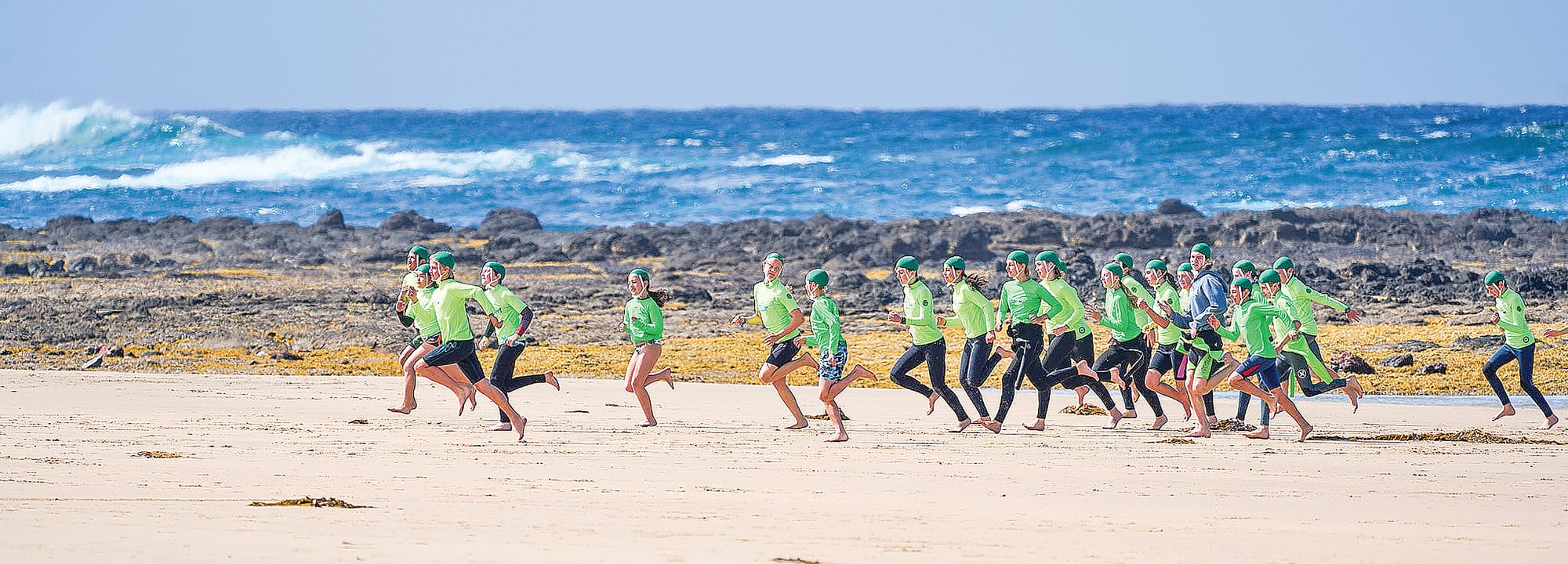 The Under 13s at Smiths Beach warm up with a beach run.