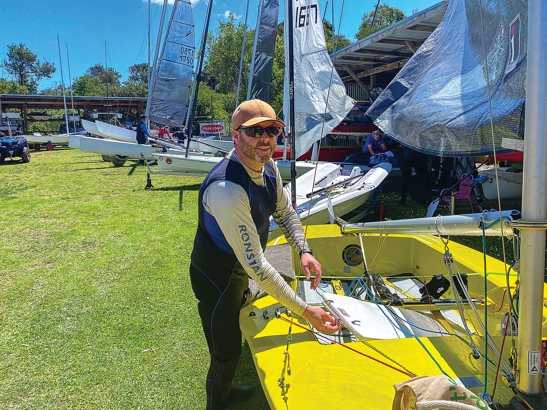 South Gippsland Yacht Club member, Matt Keily, dismantles the rigging on his Impulse yacht after an invigorating day of racing at Inverloch last Sunday.