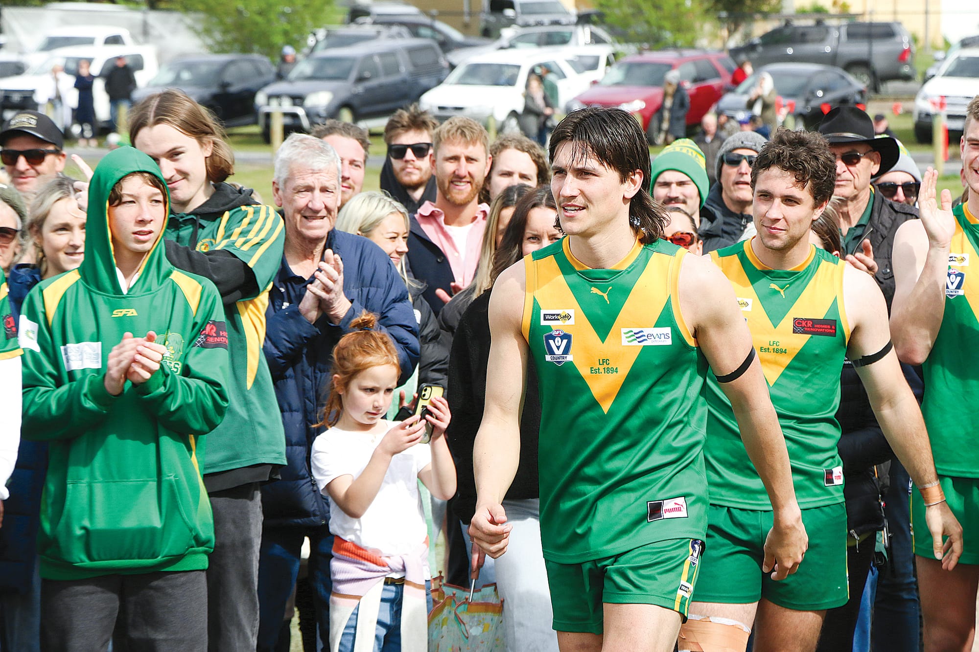 Tim Sauvarin goes up to receive his ‘best-on-ground’ medal after the Reserves grand final.