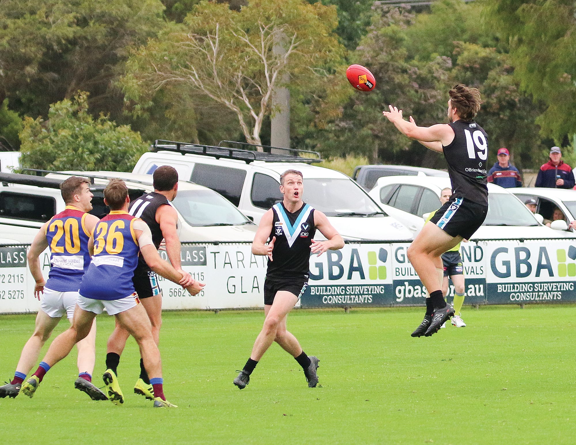 Jakeb Thomas for Power flies across the ground to take the mark. 
