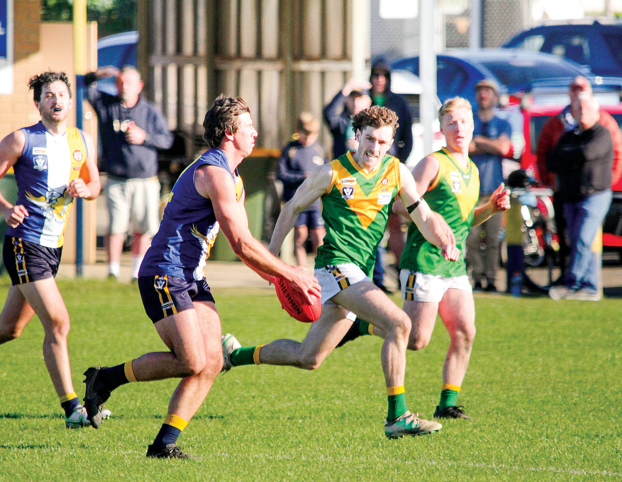 Ethan Park looks upfield before disposing of the ball. B04_3122