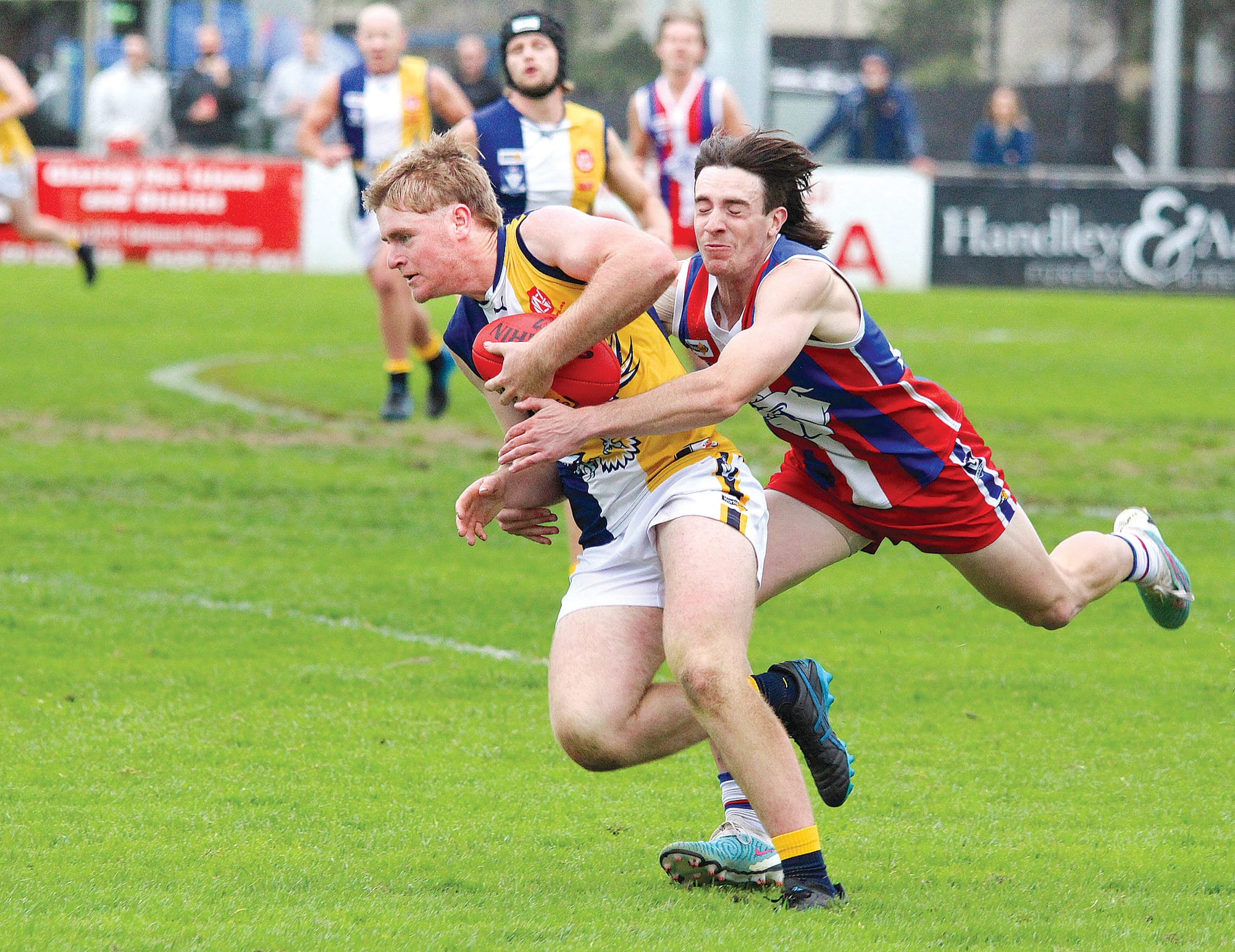 IK recruit Kairon Dorling attempts to escape the grasp of Kai Mackenzie at the Cowes Recreation Reserve. B04_1723
