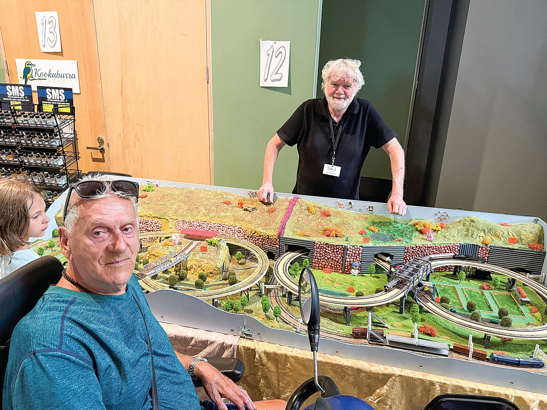 Taking an interest in the ‘Japanese Outline’ model built by David Hall of Cowes is visitor to the Philip Island Model Railway Exhibition John Christensen.