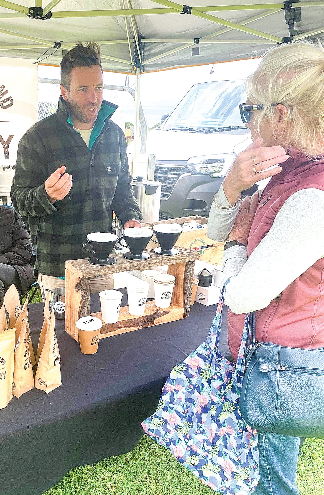 Luke Soussa of Phillip Island Chicory chats about the benefits of drinking chicory at the Churchill Farmers Market on Saturday.
