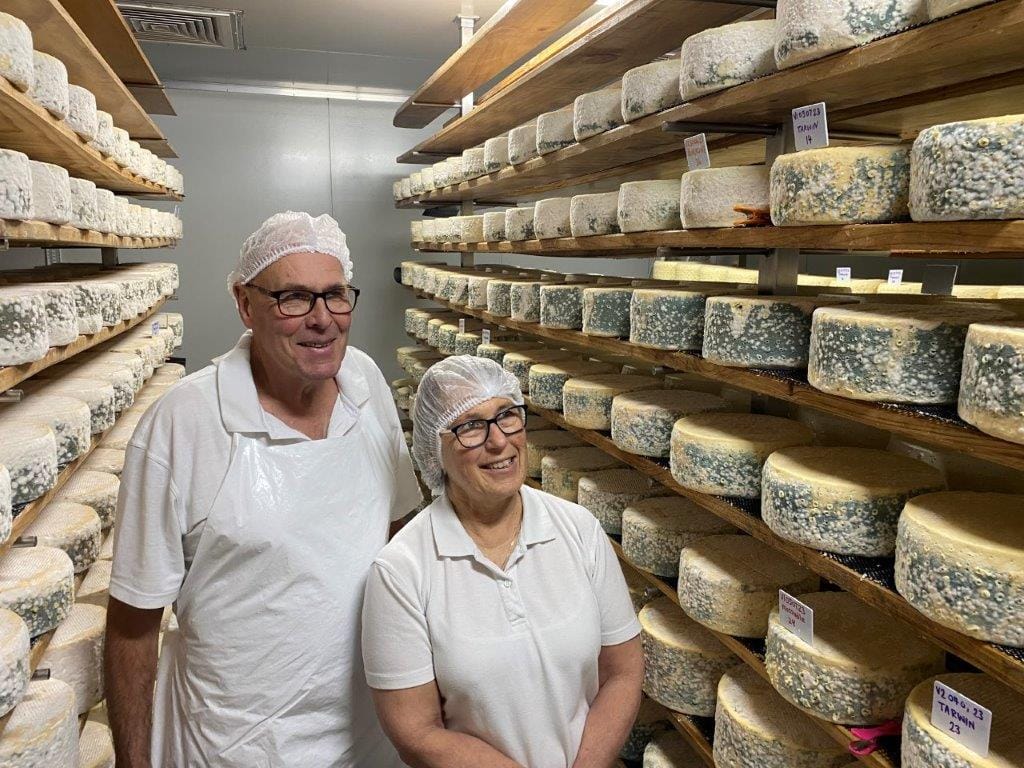 Barry Charlton and Cheryl Hulls of Berrys Creek Gourmet Cheese with some of the award-winning cheese at their artisan cheese plant near Fish Creek.