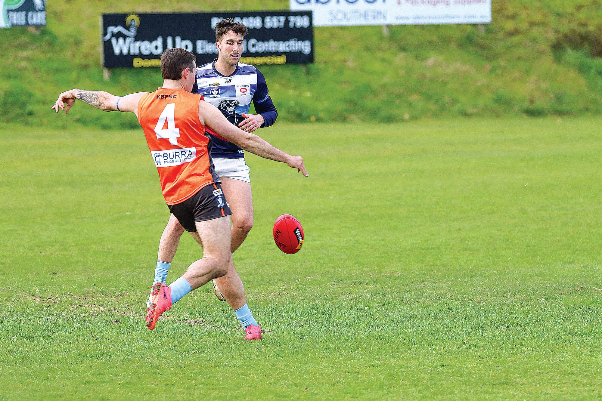 Byron Walker kicks for Korumburra-Bena early in the contest against Kilcunda-Bass. A17_3324