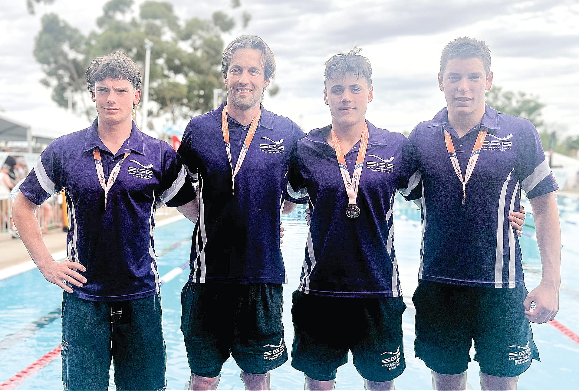 The men’s A team open 4 x 100 metre freestyle bronze medal winners.