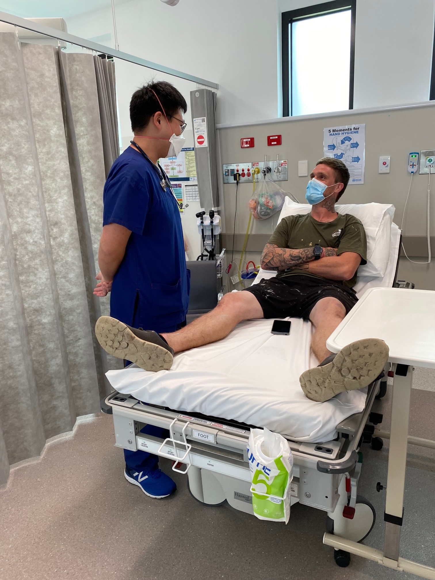 Dr Caleb Lin consults patient Patrick Byrne in the Urgent Care Centre at the Phillip Island Health Hub.