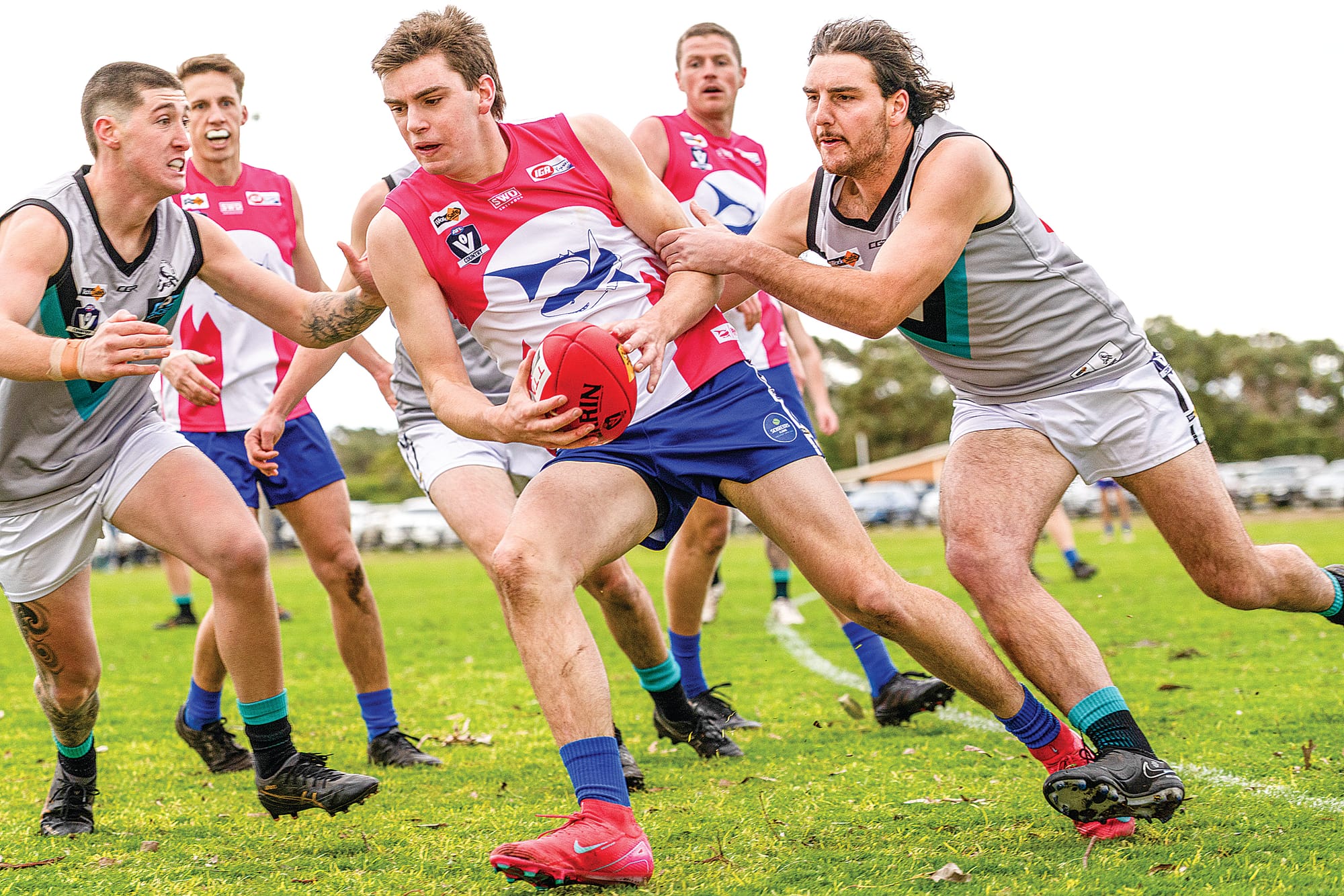 A tackle from both sides for Calum McLeod.