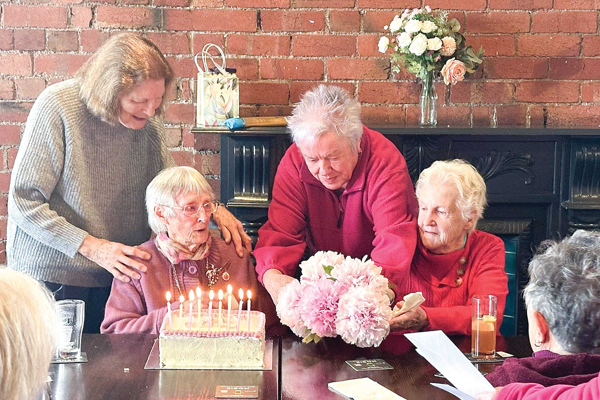 Avis Tilley is gifted with cake and flowers from her many friends on her 99th birthday. ob07_3924