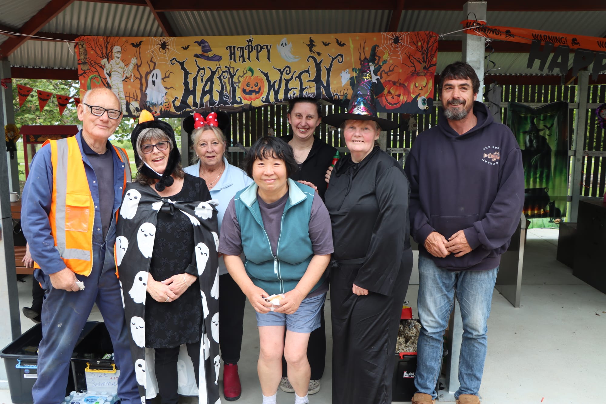 Welshpool and District Advisory Group members host the Halloween barbecue, with Eddie Fowler, Di Casey, Colleen Beer, Jing Johns, Candice Astley, Madelaine Mason and Andrew Bradford.