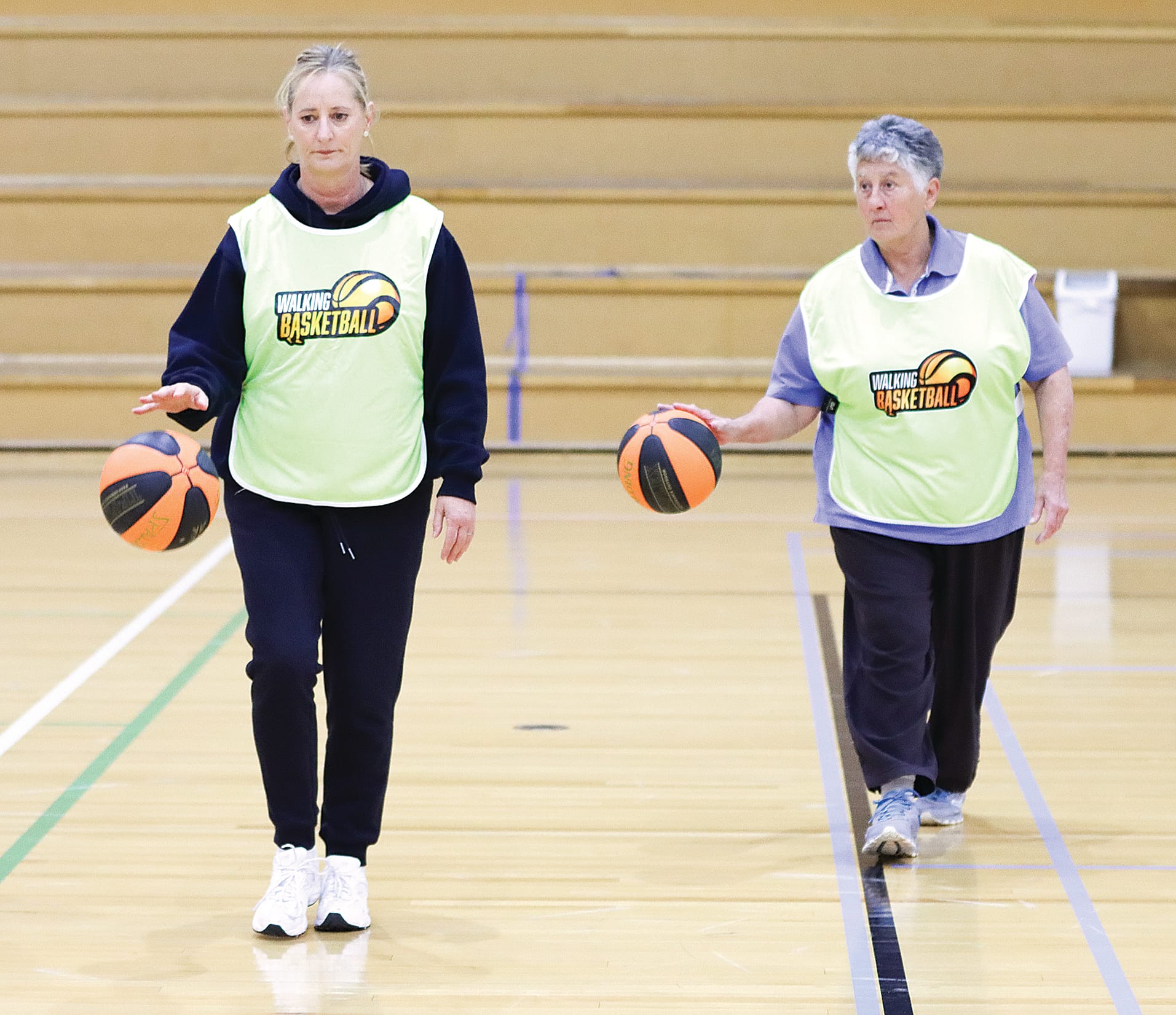 Kathy Perry of Basketball Victoria and Anne Parkes show off their dribbling skills. A06_4425