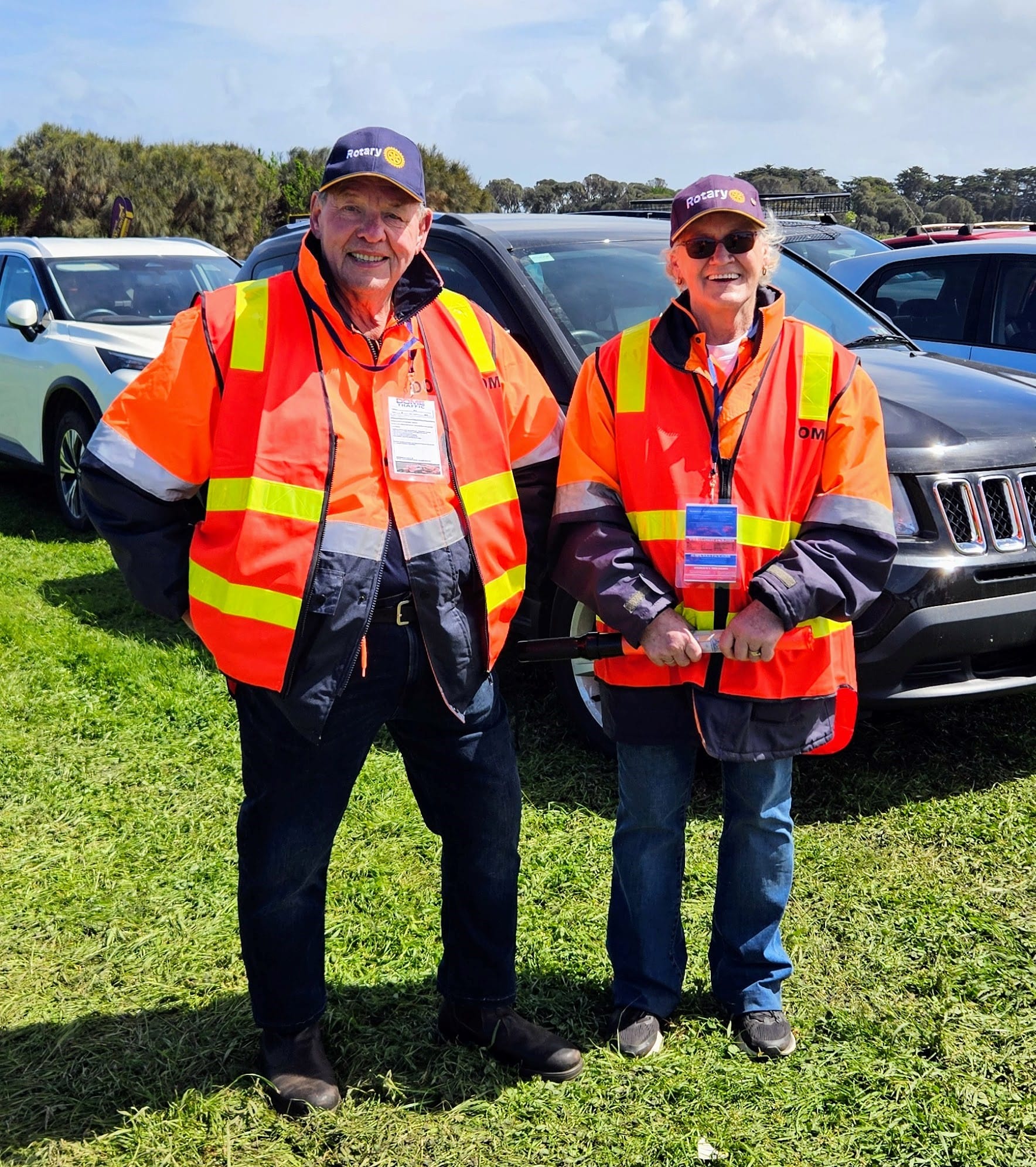 Clad in bright orange safety jackets, Rotary’s dedicated team worked tirelessly to direct traffic and assist arriving spectators, ensuring a smooth and safe entry to the 2025 Grand Prix. L to R: Stuart Liddel, and Cheryl Harvey. 
