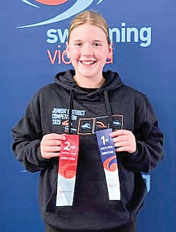 Millie with her ribbons at the Country Junior District Competition.