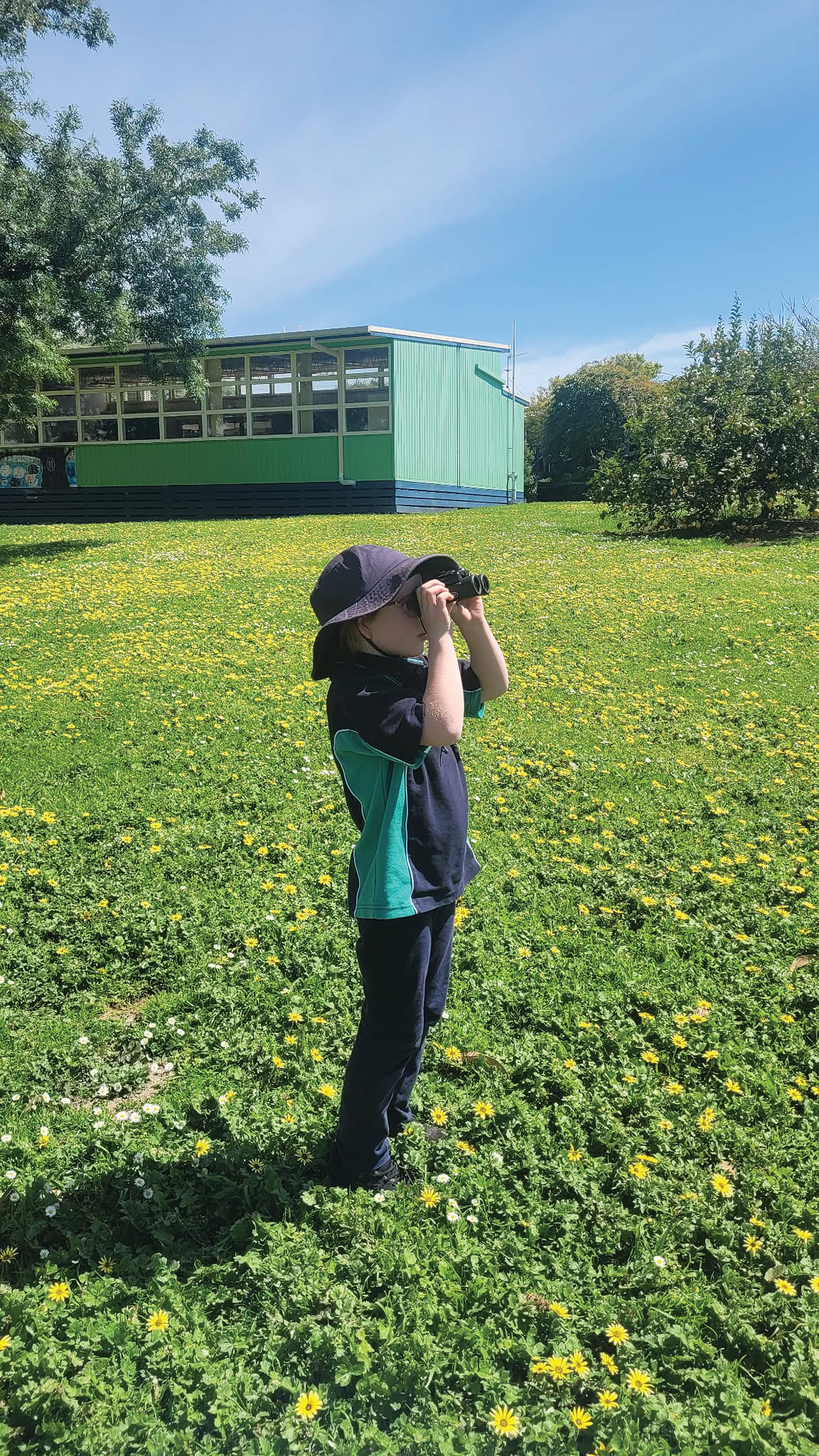 Poowong Consolidated School student observes local birdlife as part of the school’s citizen science program.