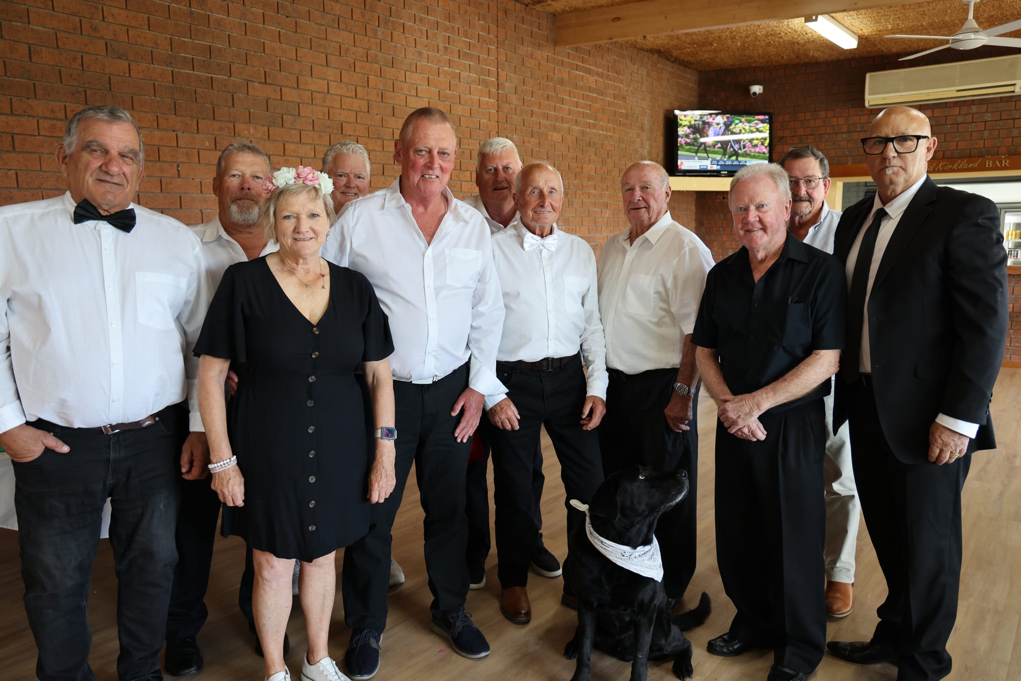 Lou, Haydn, San Remo Bowls Club President Marie McKiernan, Tony, Tony, Barry, John, Ron, Neil, Bobby, James and dog Jack helping to serve food and drinks for Oaks Day. B19_4525