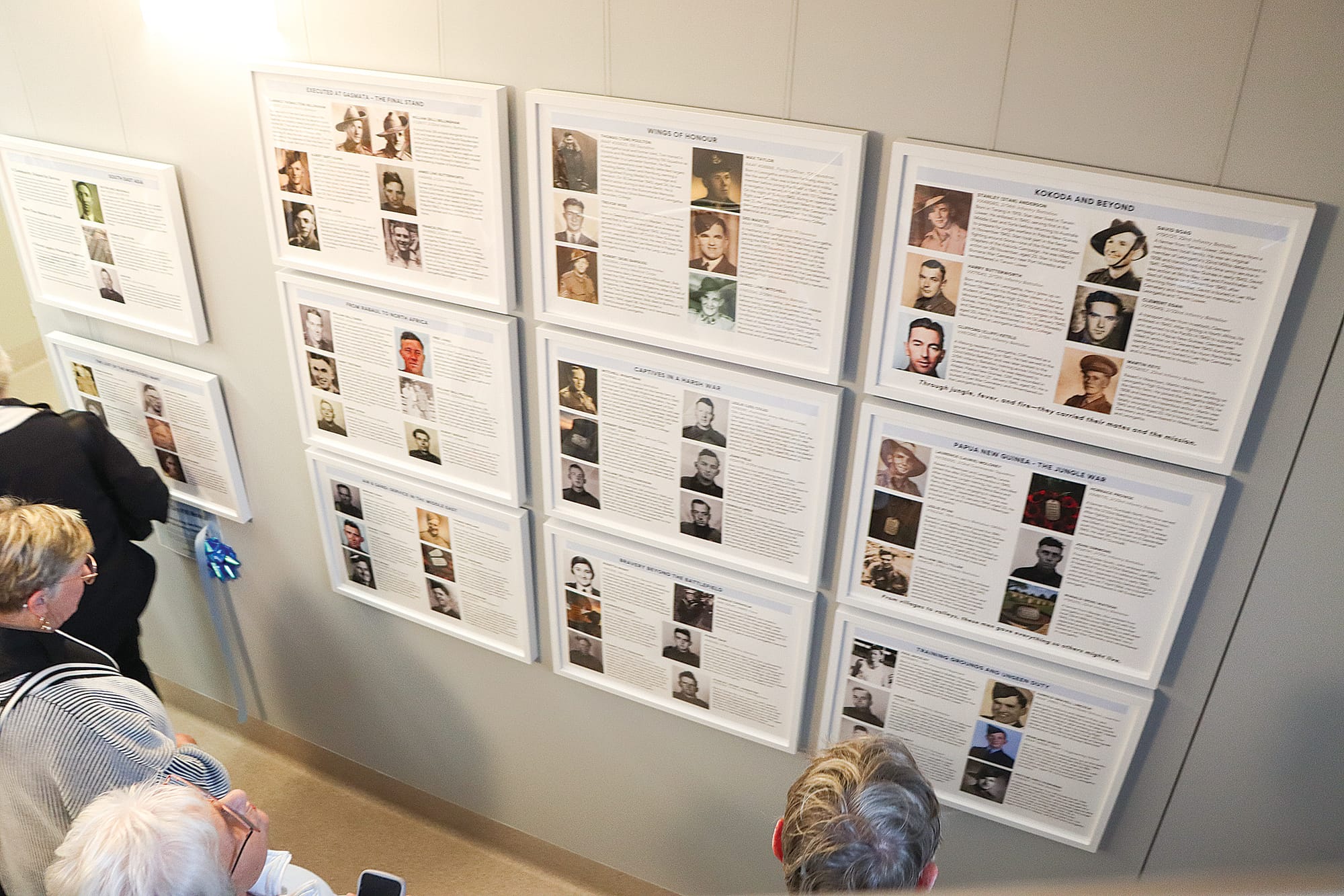 People read tributes to those who served, on the newly opened Memorial Walk at Leongatha Memorial Hospital. A72_4225