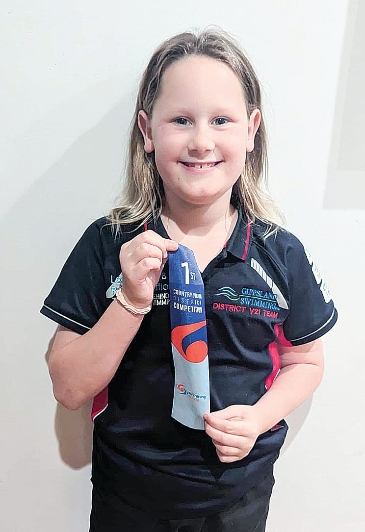 Caitlan with a first place ribbon at the Country Junior District Competition.