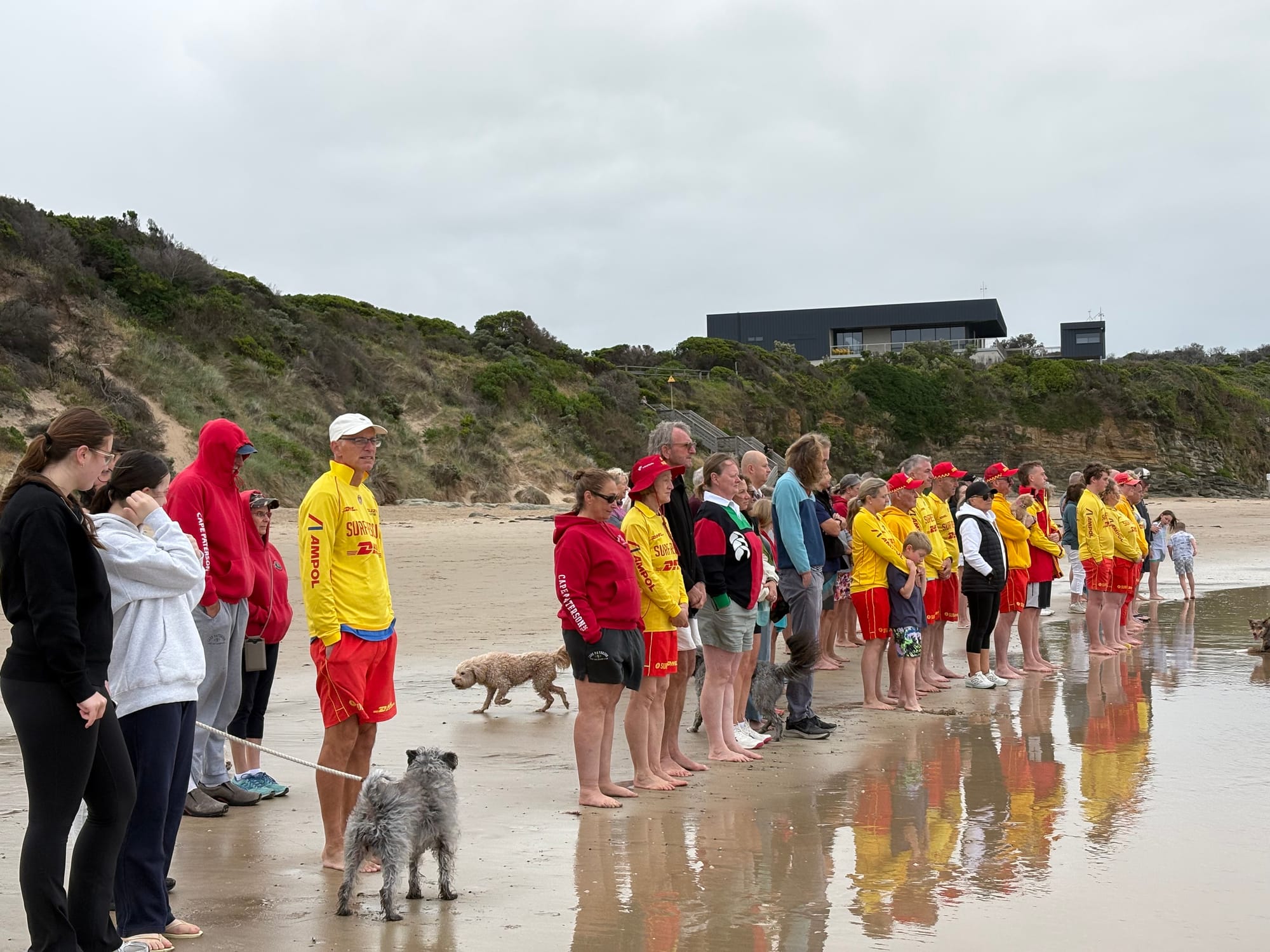 Shoulder to Shoulder: Silent reflection on the water’s edge