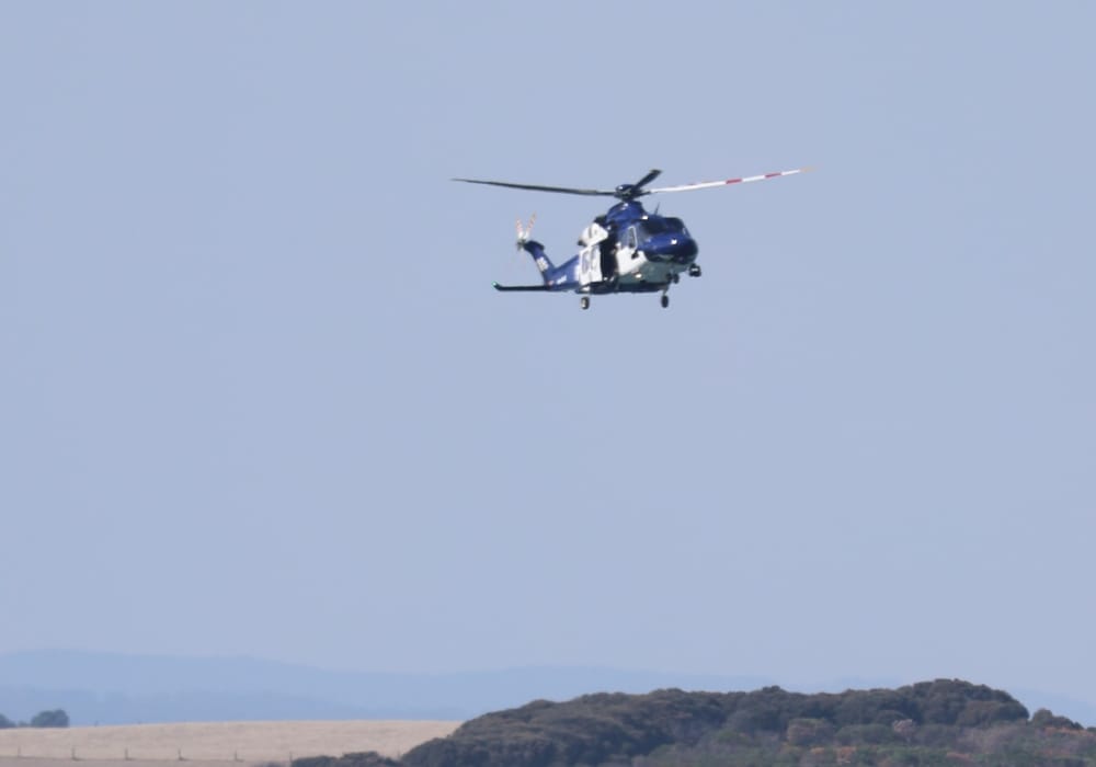 Search continues for male swept off rocks at Punch Bowl post image