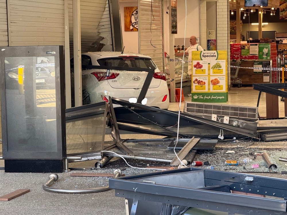 Narrow escape for Woolworths employees as car smashes through shopfront post image