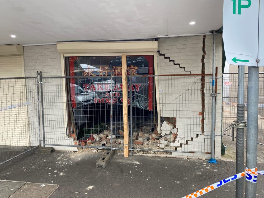 Close call after car smashes into restaurant post image
